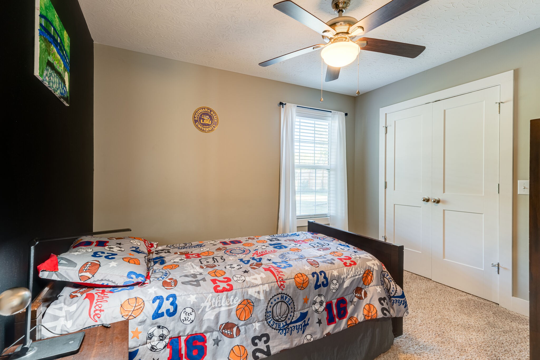 1688 Rock Bridge Road Bethpage, TN 37022 - Photo 12 of 29 a bedroom with a bed and a chandelier fan