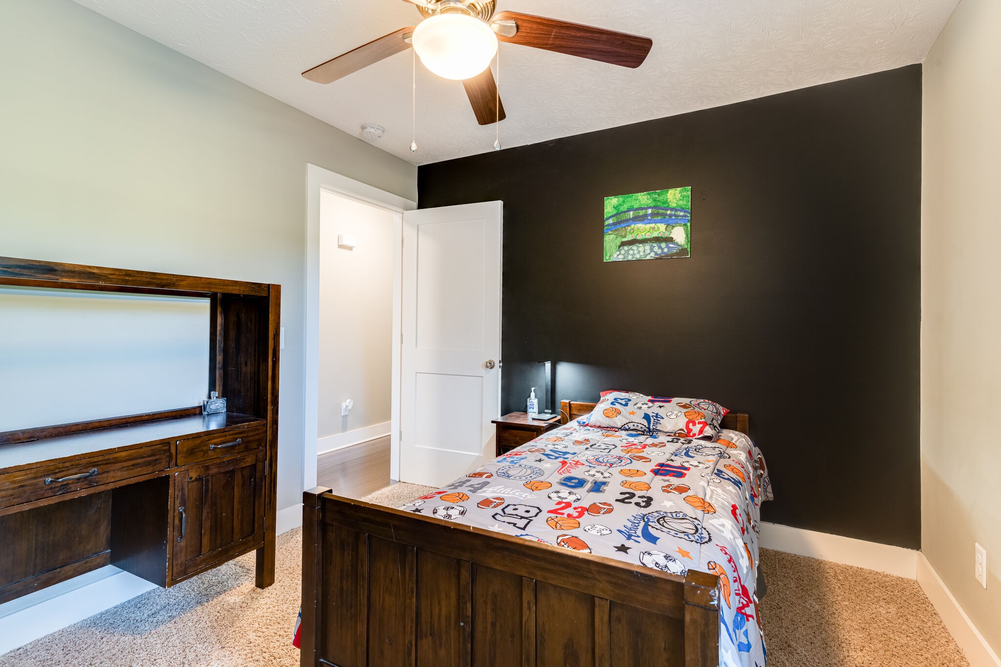 1688 Rock Bridge Road Bethpage, TN 37022 - Photo 13 of 29 a bedroom with a bed and a flat screen tv
