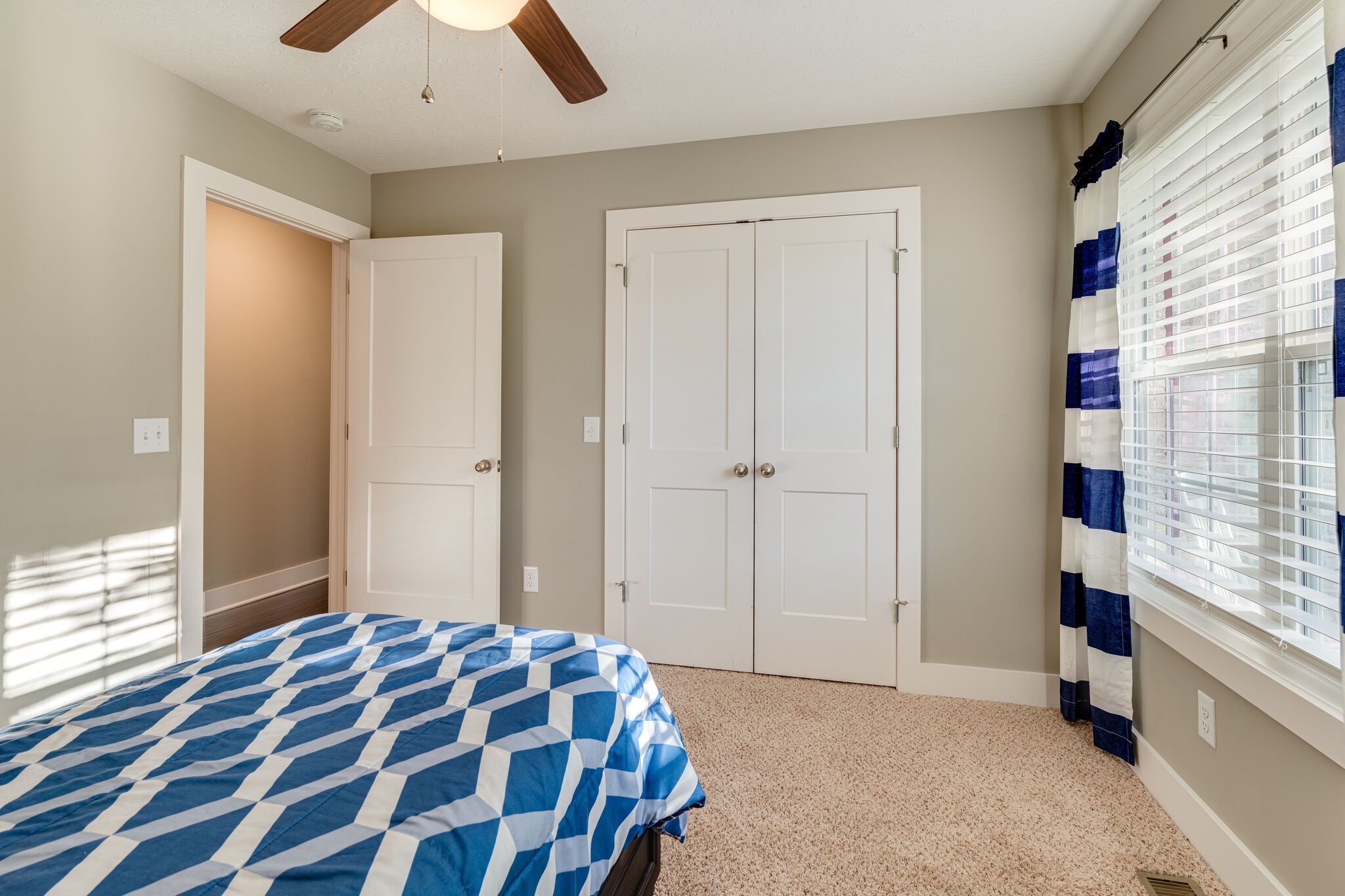 1688 Rock Bridge Road Bethpage, TN 37022 - Photo 15 of 29 a bedroom with a bed and a chandelier