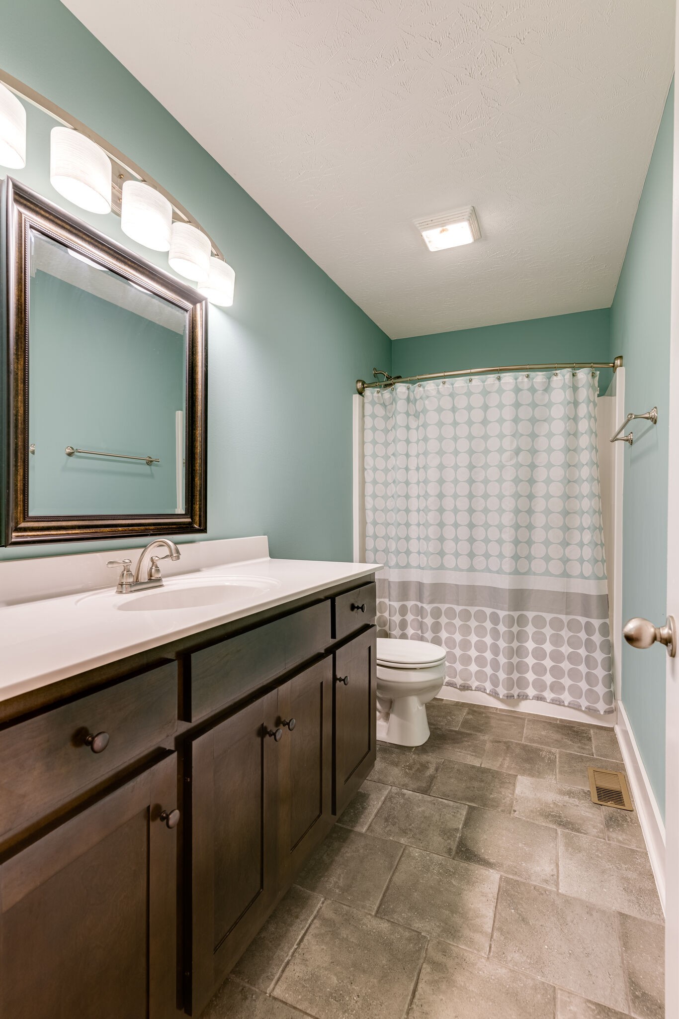 1688 Rock Bridge Road Bethpage, TN 37022 - Photo 16 of 29 a bathroom with a double vanity sink toilet and shower
