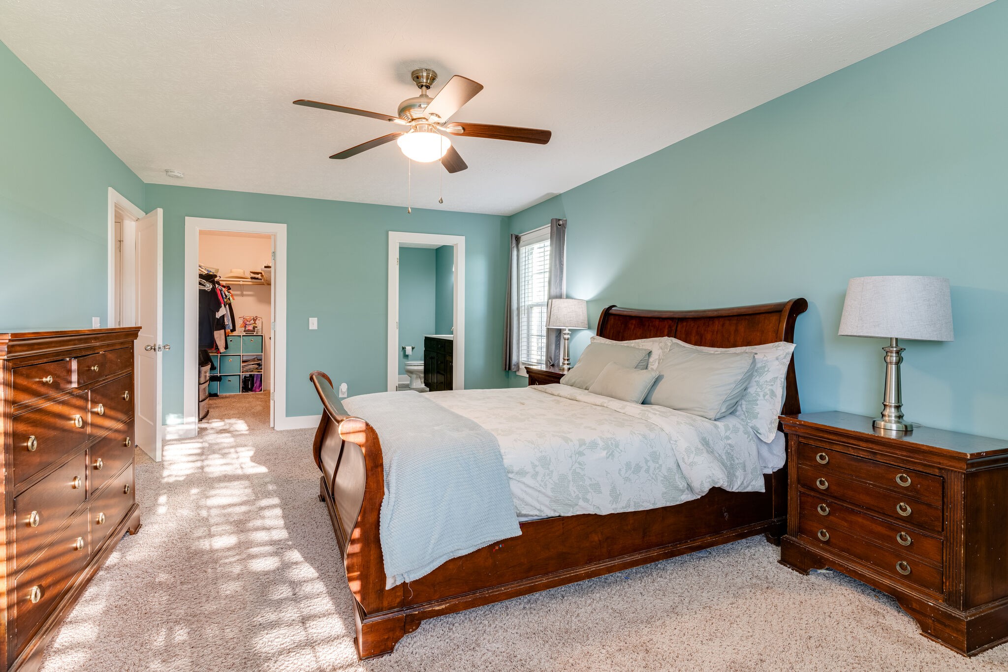 1688 Rock Bridge Road Bethpage, TN 37022 - Photo 18 of 29 a bedroom with a bed and a chandelier