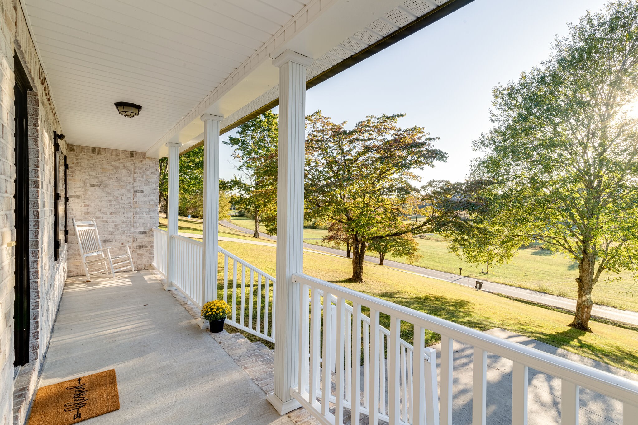 1688 Rock Bridge Road Bethpage, TN 37022 - Photo 4 of 29 a view of a porch with wooden floor and fence