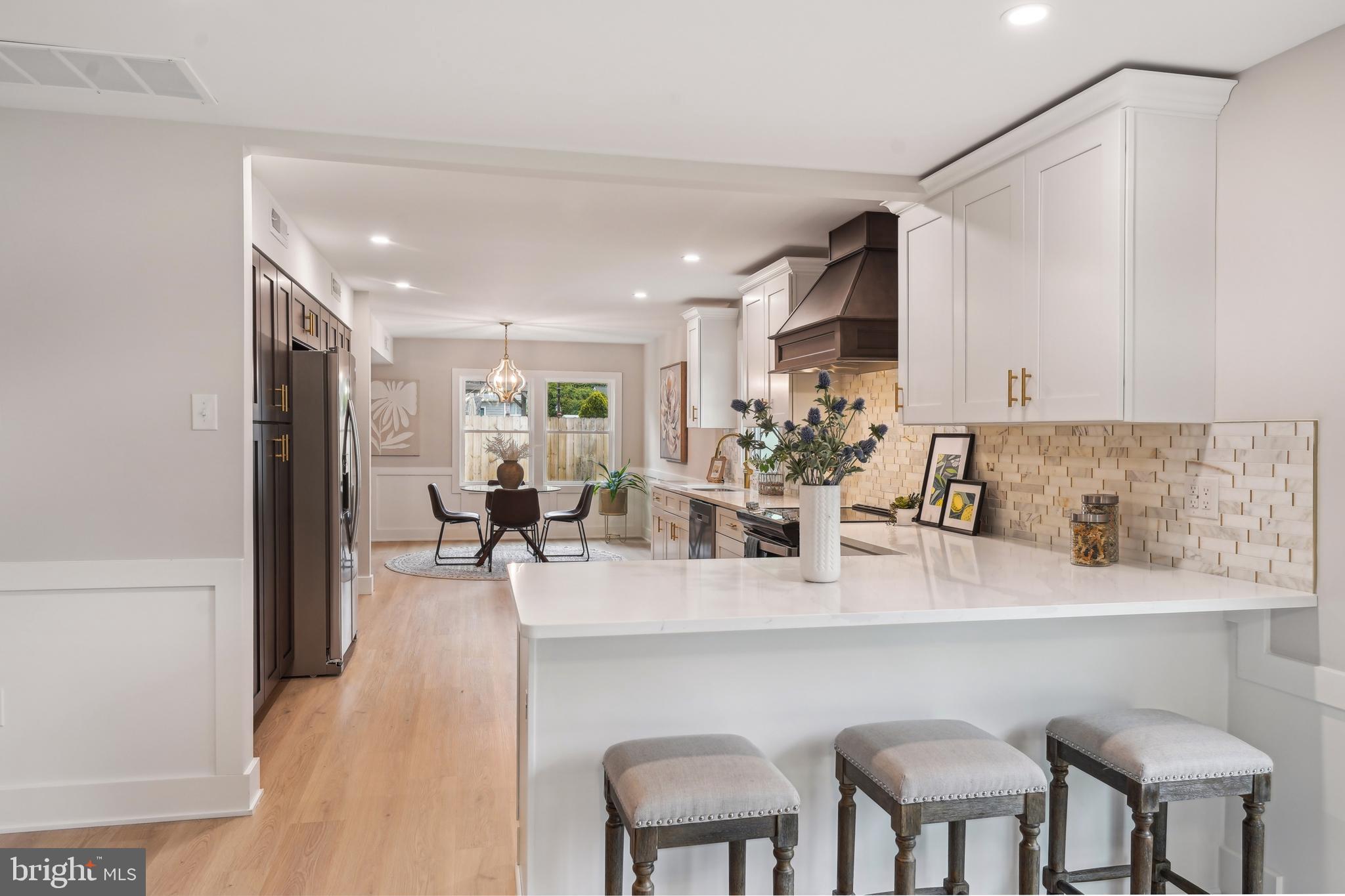 44 Concord Road Marlton, NJ 08053 - Photo 13 of 43 a kitchen with stainless steel appliances granite countertop a table chairs sink and cabinets