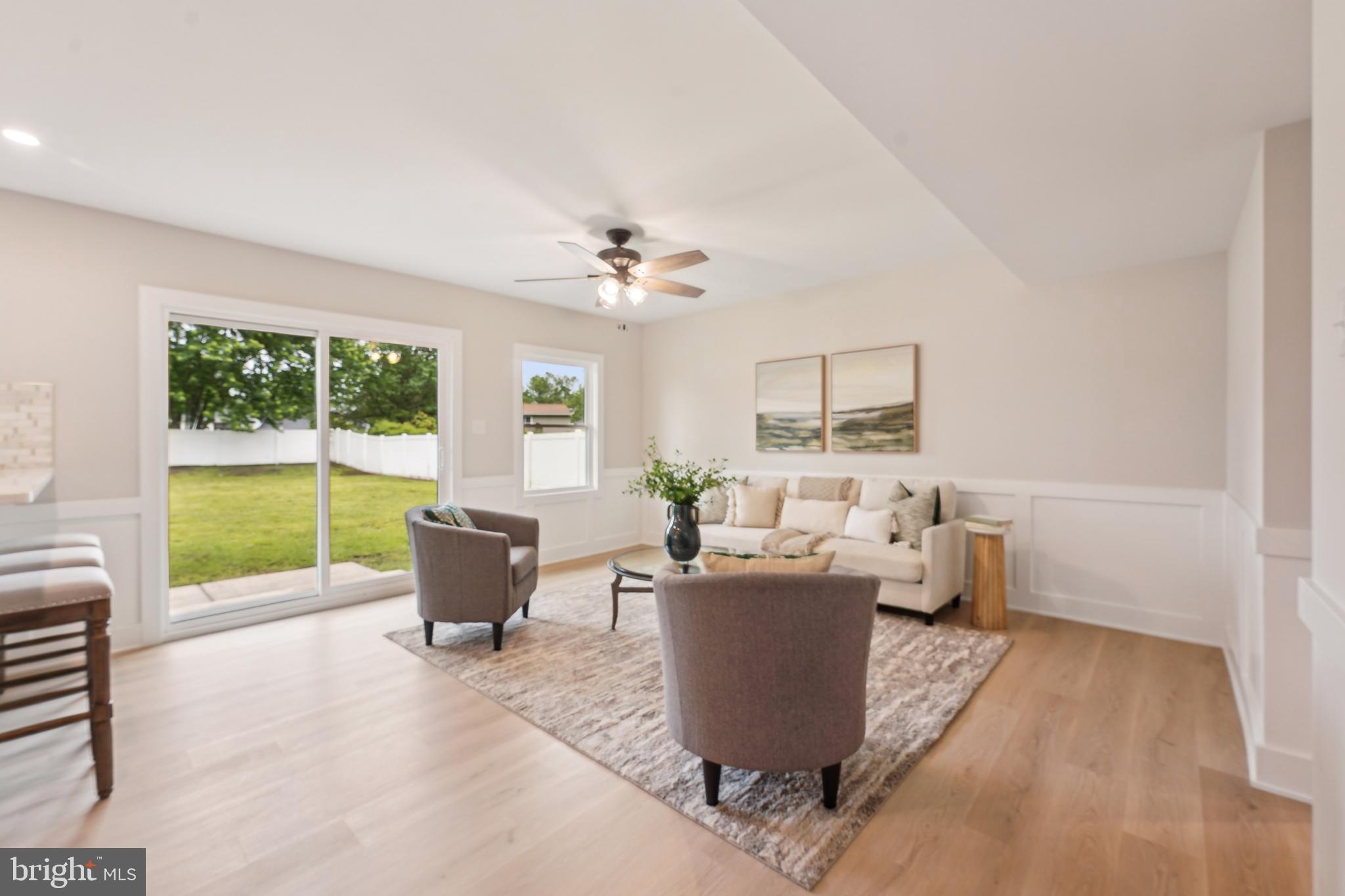 44 Concord Road Marlton, NJ 08053 - Photo 19 of 43 a living room with furniture a large window and a table
