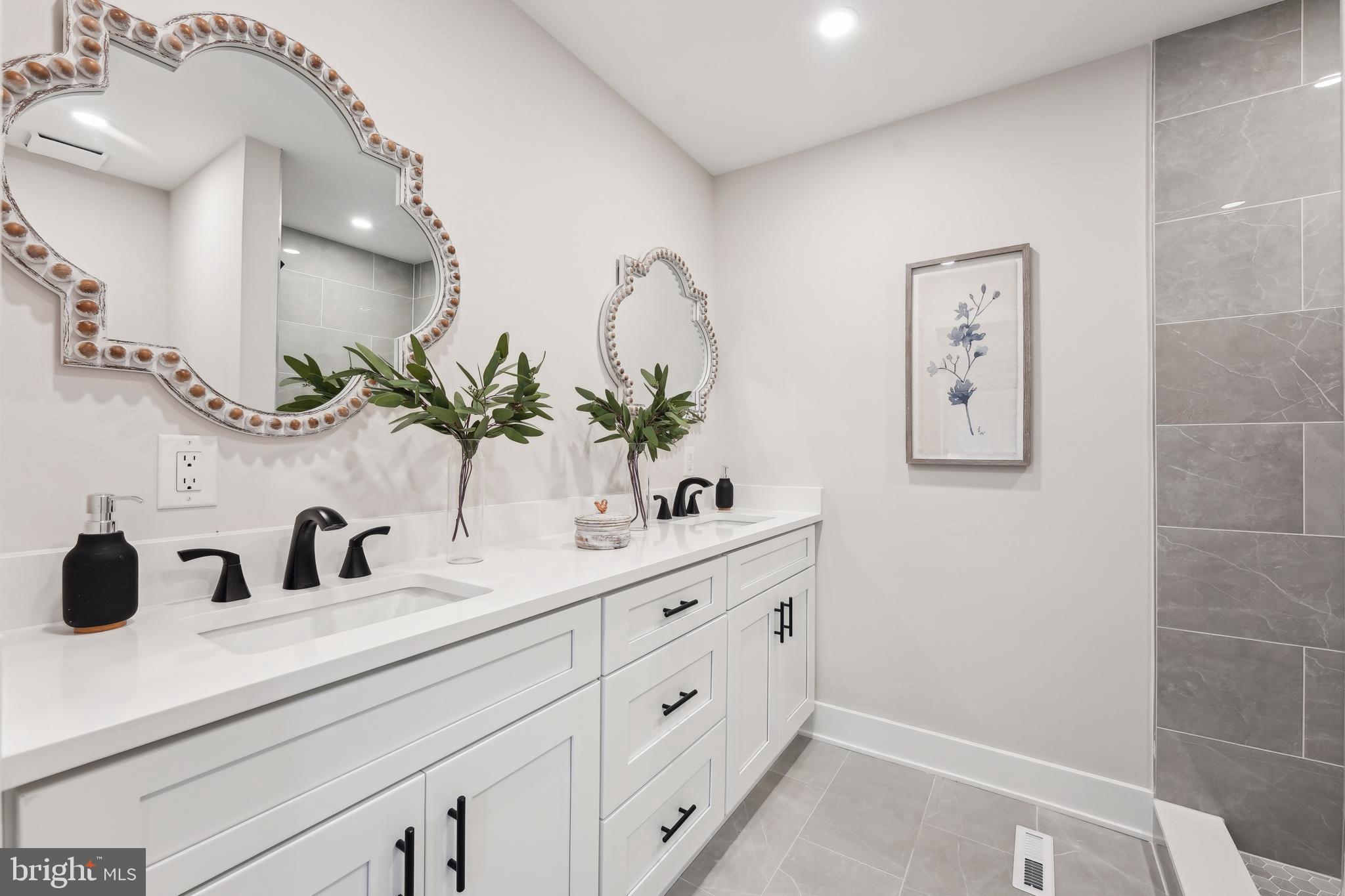 44 Concord Road Marlton, NJ 08053 - Photo 28 of 43 a bathroom with a double vanity sink and a mirror