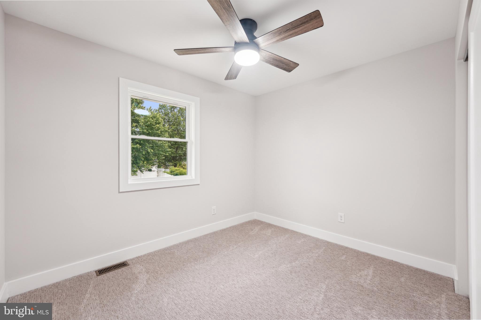 44 Concord Road Marlton, NJ 08053 - Photo 30 of 43 an empty room with a window and a fan