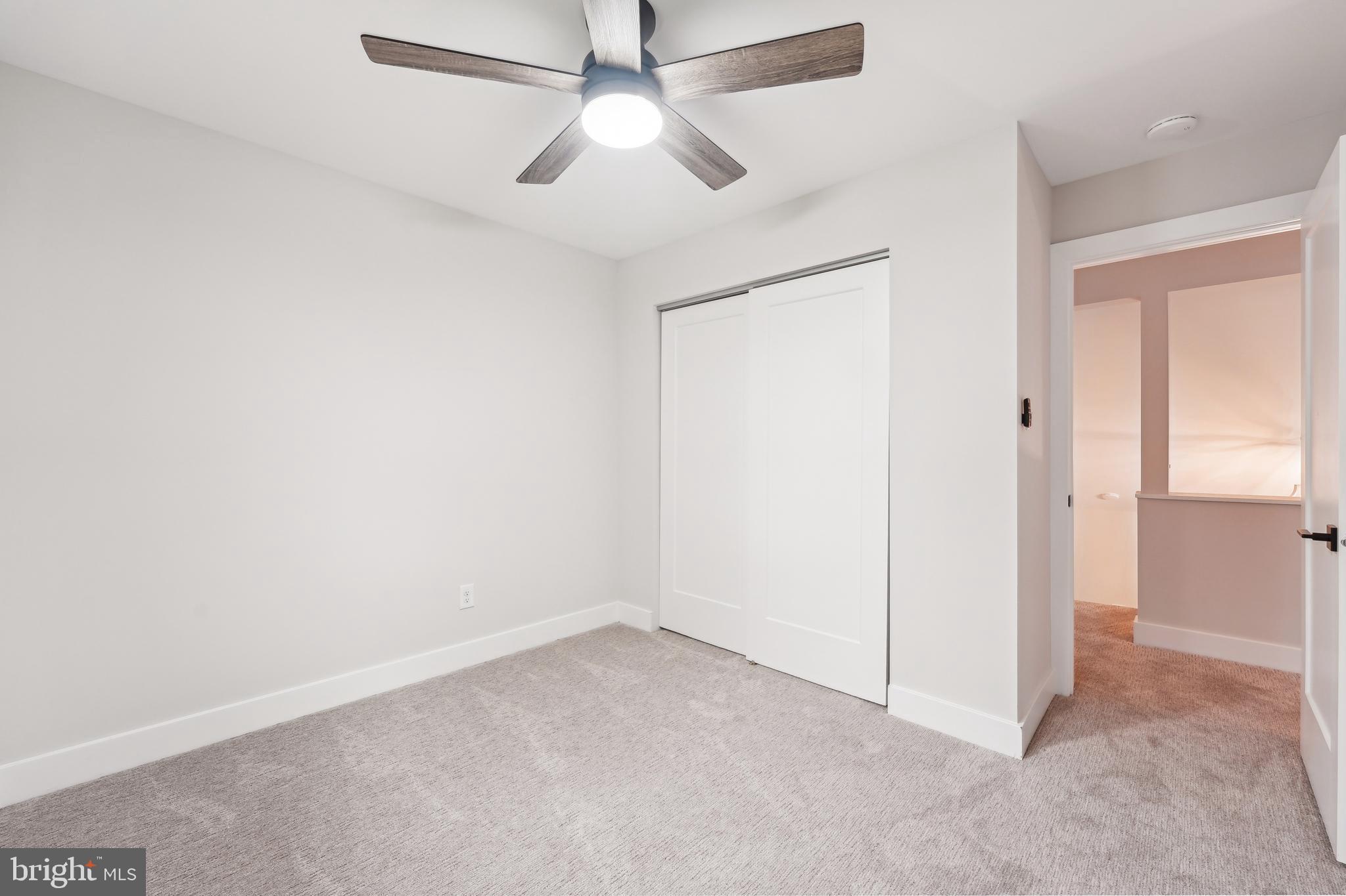 44 Concord Road Marlton, NJ 08053 - Photo 31 of 43 an empty room with a ceiling fan and a window