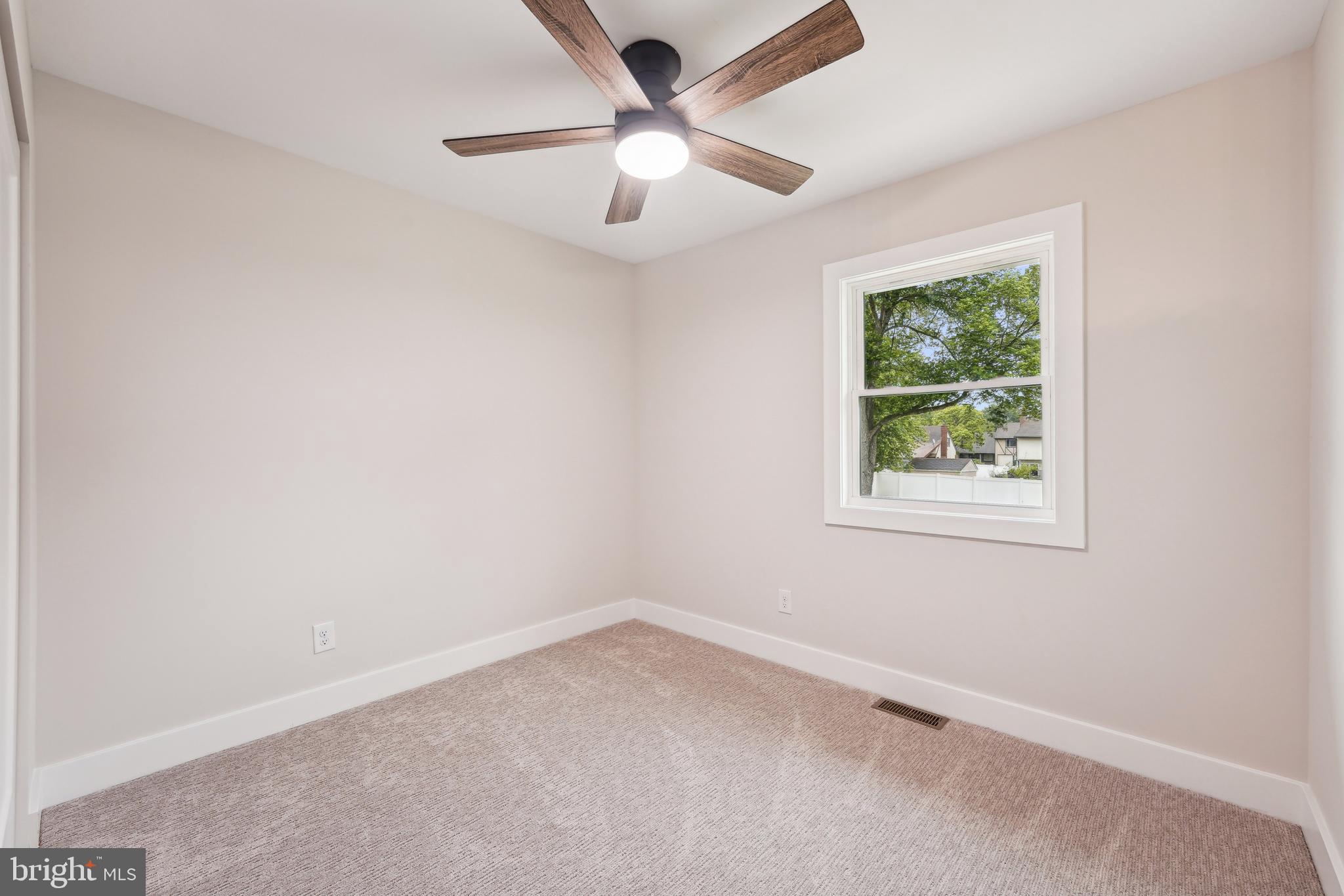 44 Concord Road Marlton, NJ 08053 - Photo 32 of 43 an empty room with a window and a fan