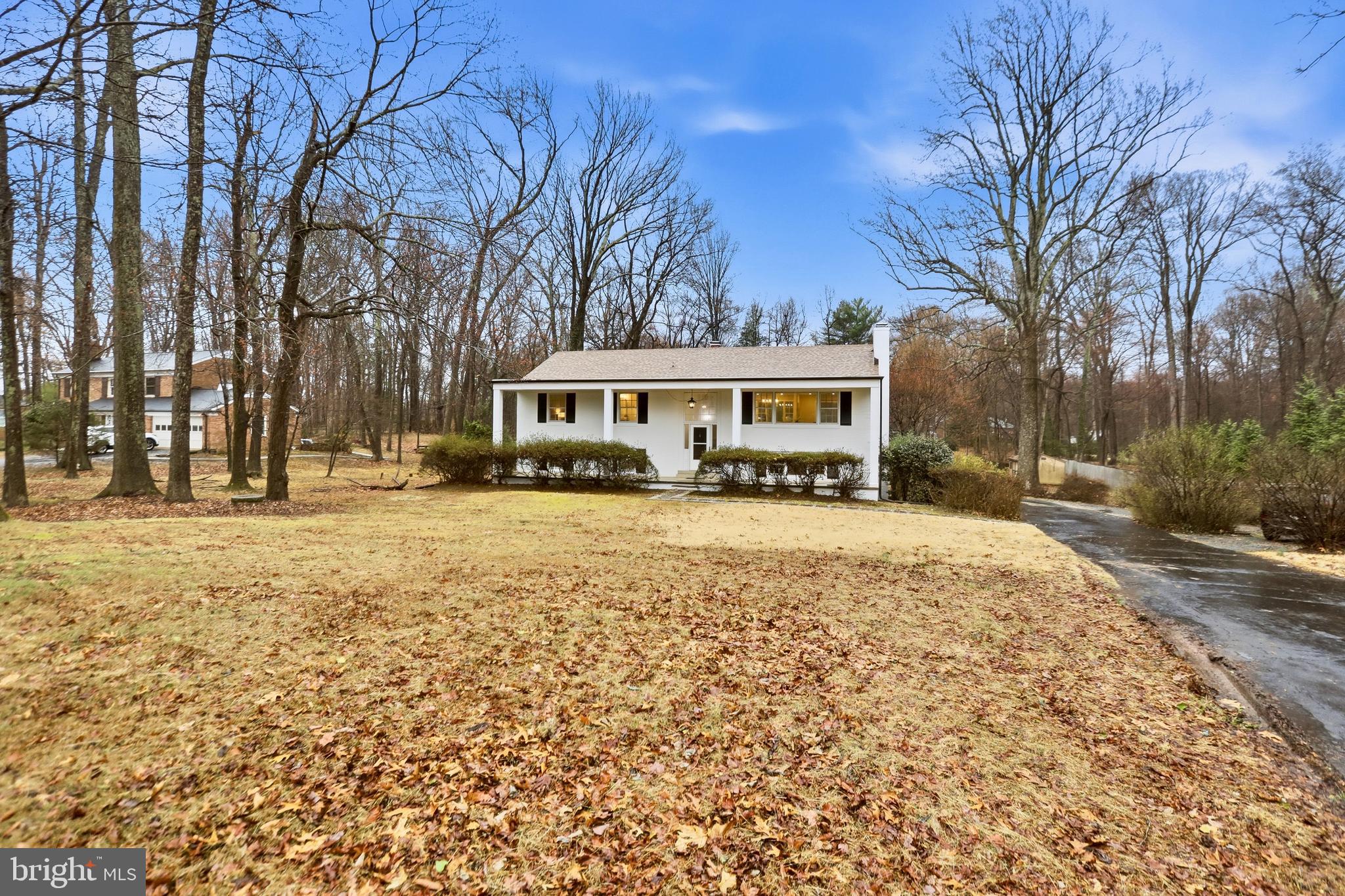 11328 Vale Road Oakton, VA 22124 - Photo 1 of 34 a front view of a building with trees