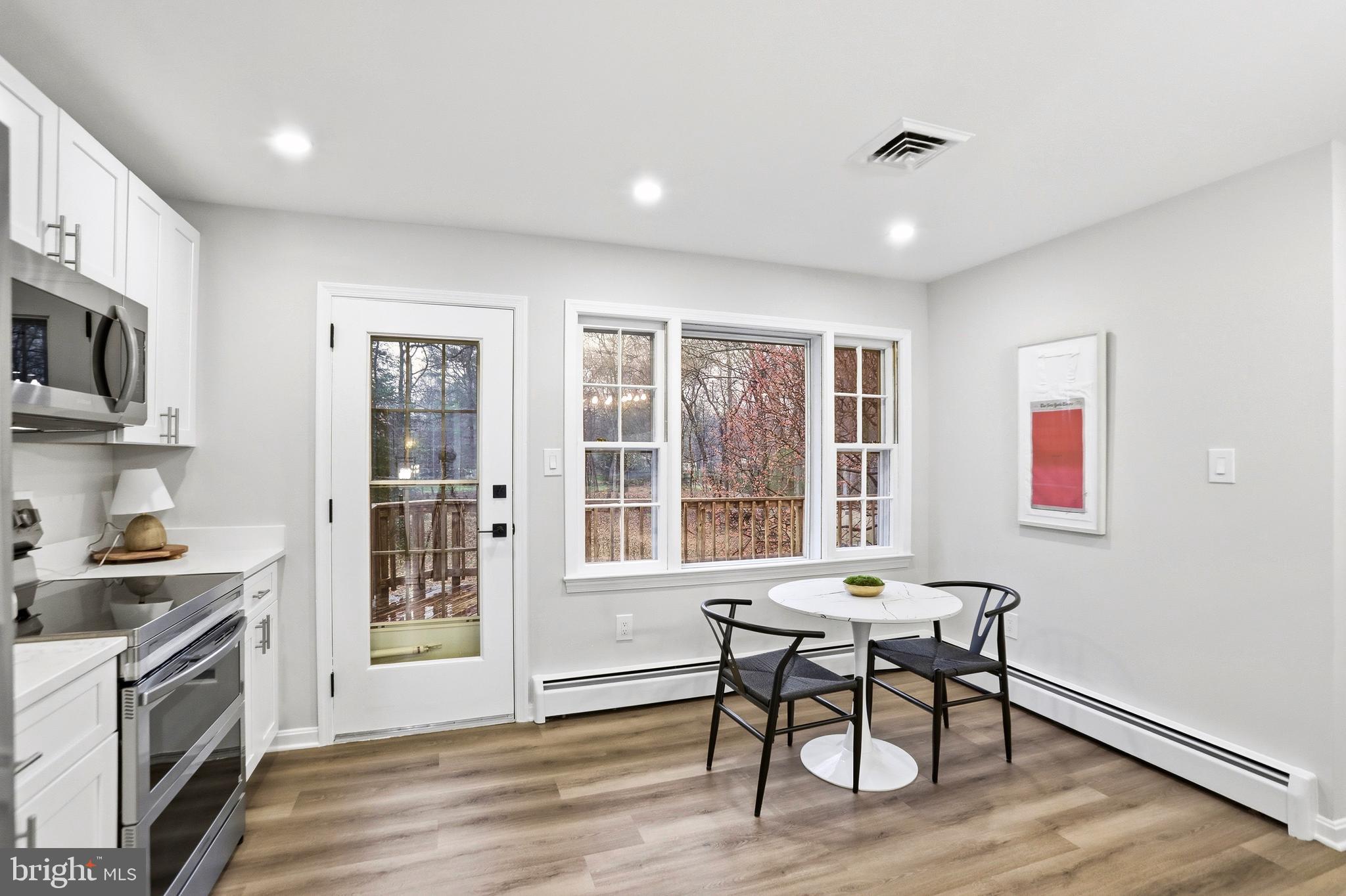 11328 Vale Road Oakton, VA 22124 - Photo 11 of 34 a workspace with furniture window and wooden floor