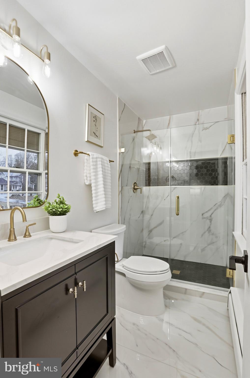 11328 Vale Road Oakton, VA 22124 - Photo 15 of 34 a bathroom with a sink toilet and shower