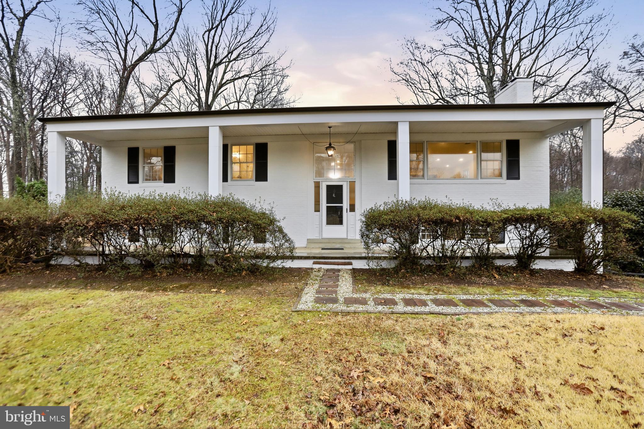 11328 Vale Road Oakton, VA 22124 - Photo 2 of 34 front view of a house with a yard