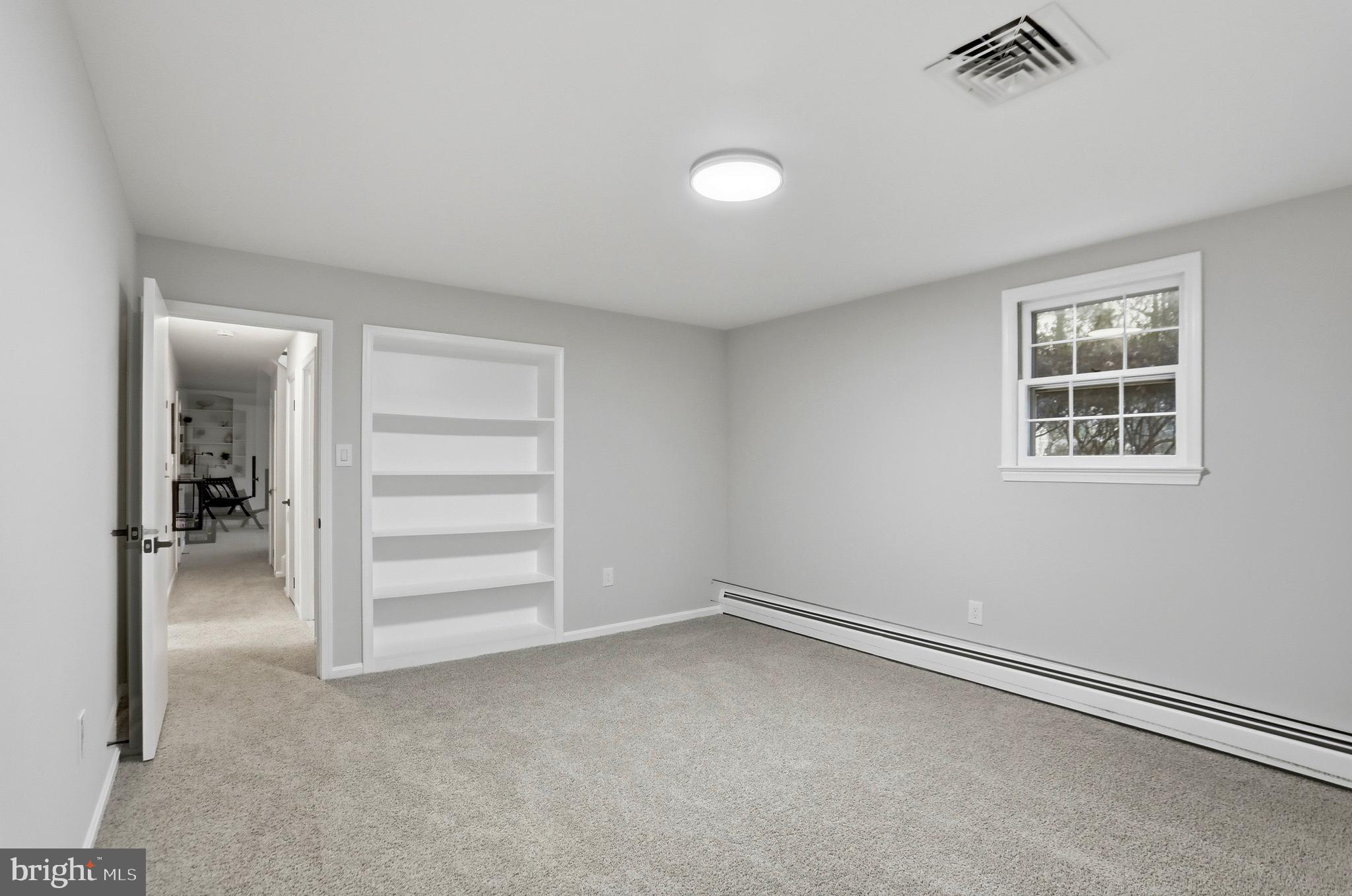 11328 Vale Road Oakton, VA 22124 - Photo 22 of 34 an empty room with a empty space and windows