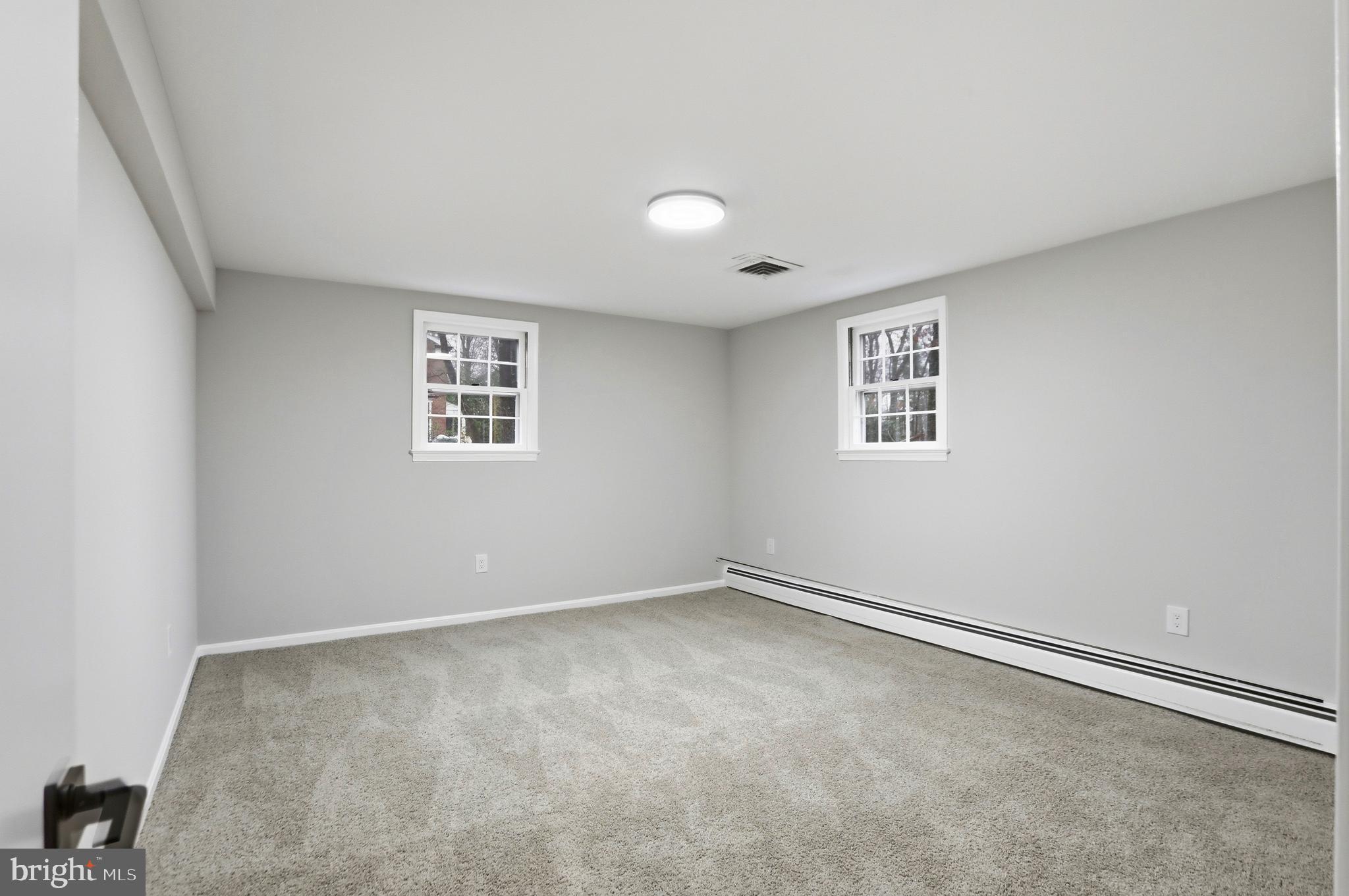 11328 Vale Road Oakton, VA 22124 - Photo 26 of 34 an empty room with windows