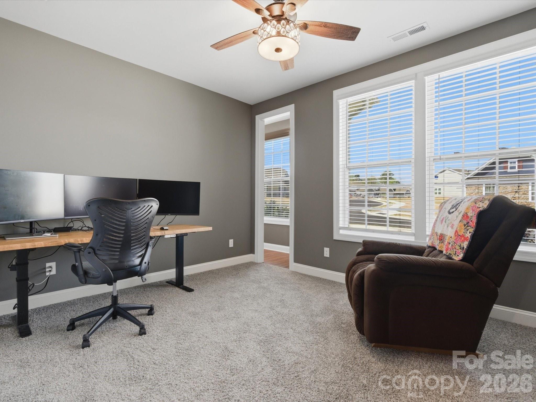 7004 Treetop Court York, SC 29745 - Photo 11 of 47 a view of a livingroom with workspace and a window