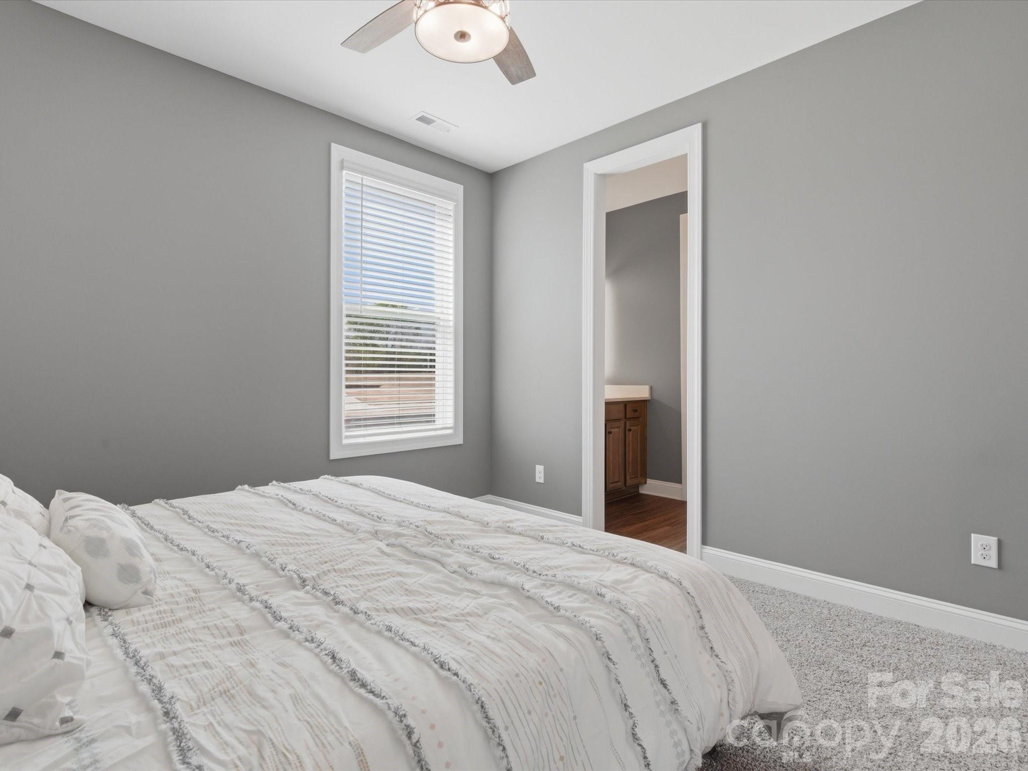 7004 Treetop Court York, SC 29745 - Photo 17 of 47 a bedroom with a bed and a window