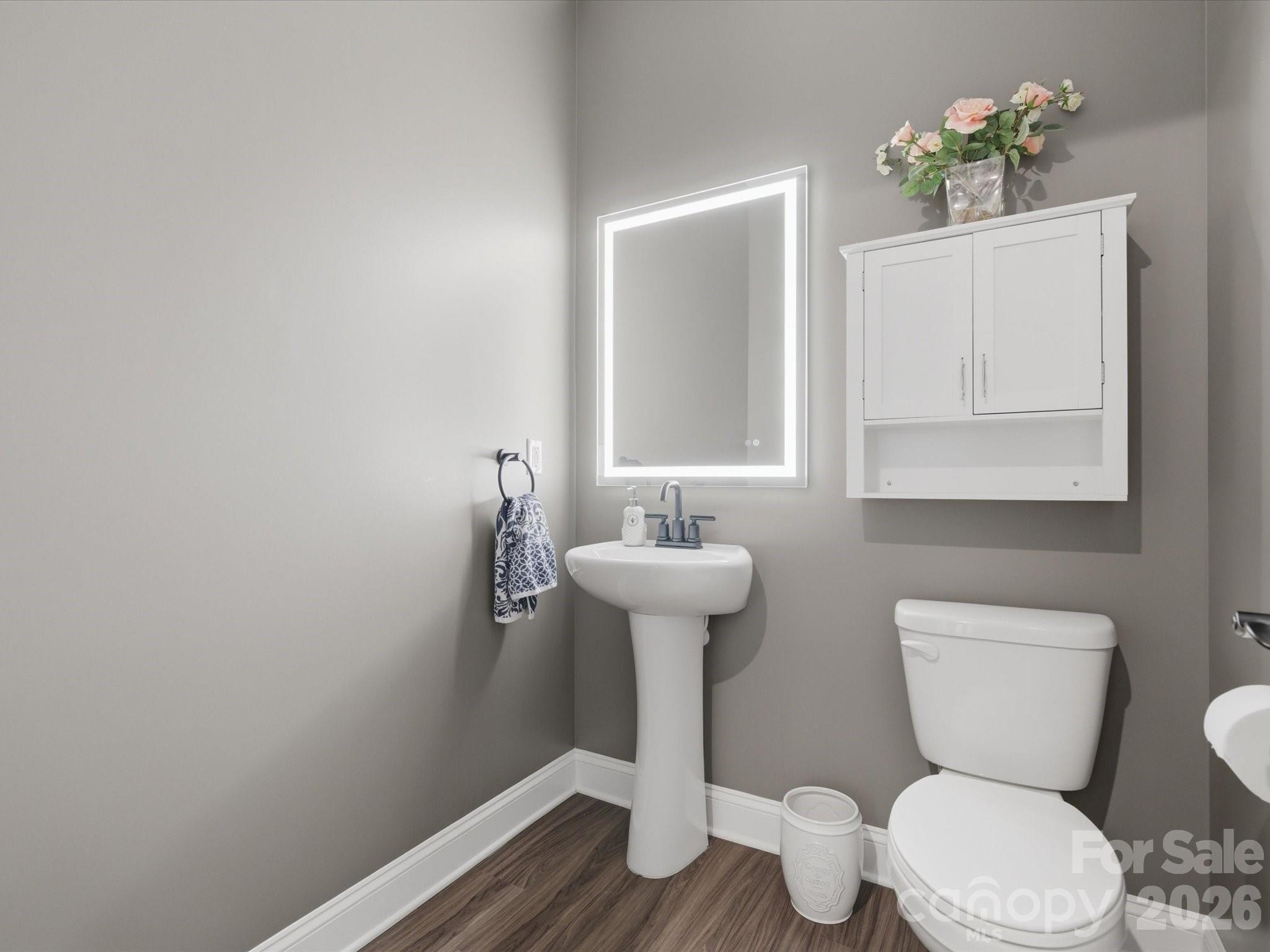7004 Treetop Court York, SC 29745 - Photo 18 of 47 a bathroom with a toilet sink and mirror