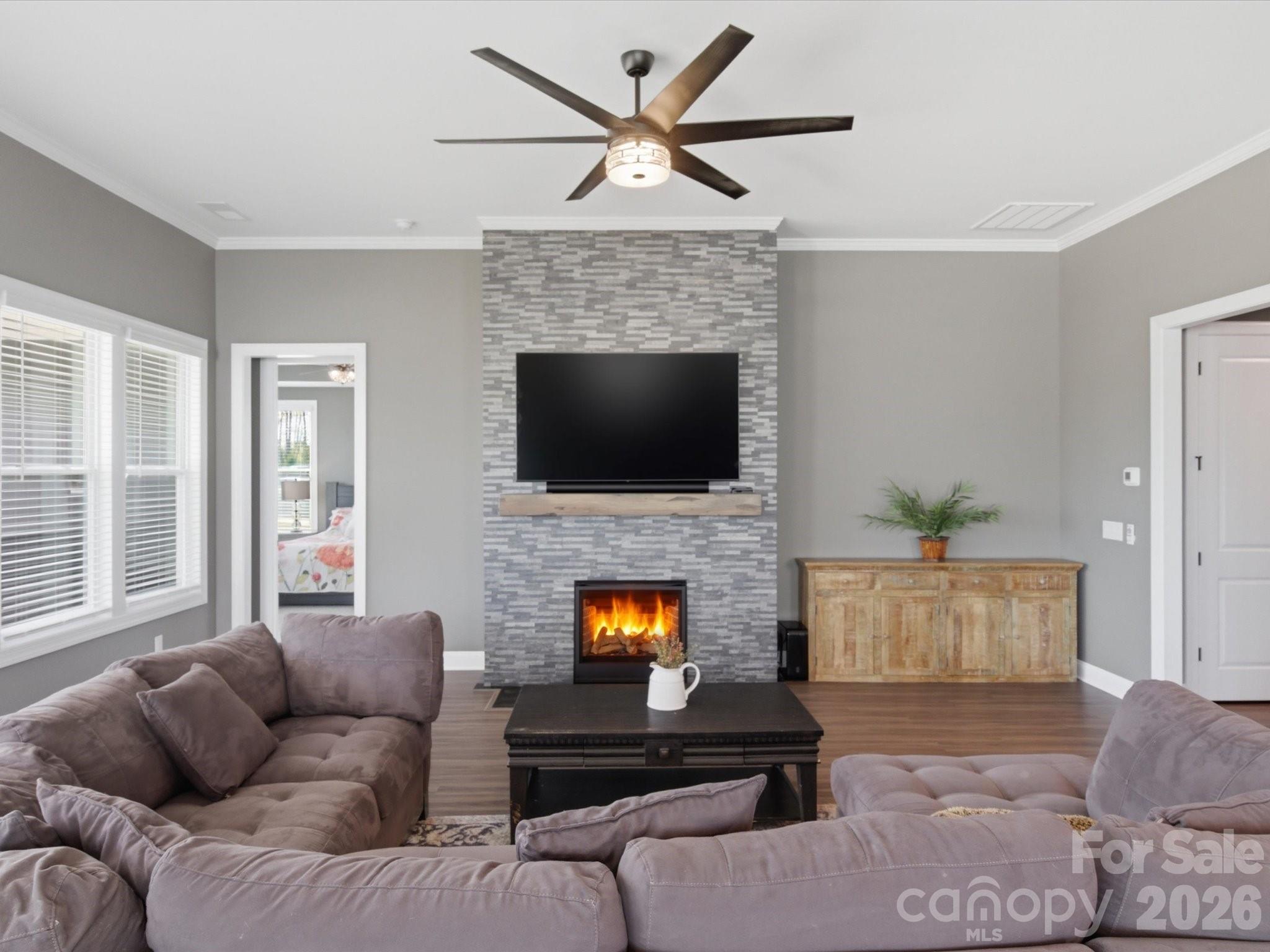 7004 Treetop Court York, SC 29745 - Photo 21 of 47 a living room with furniture fireplace and flat screen tv