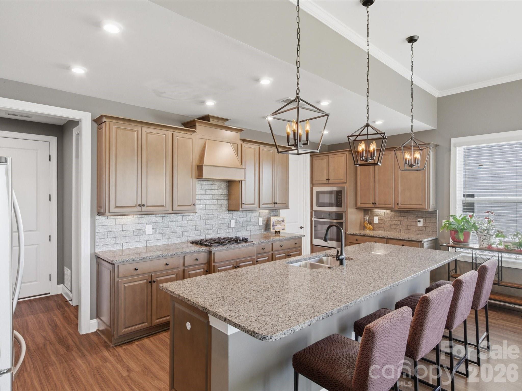 7004 Treetop Court York, SC 29745 - Photo 22 of 47 a kitchen with center island table and chairs