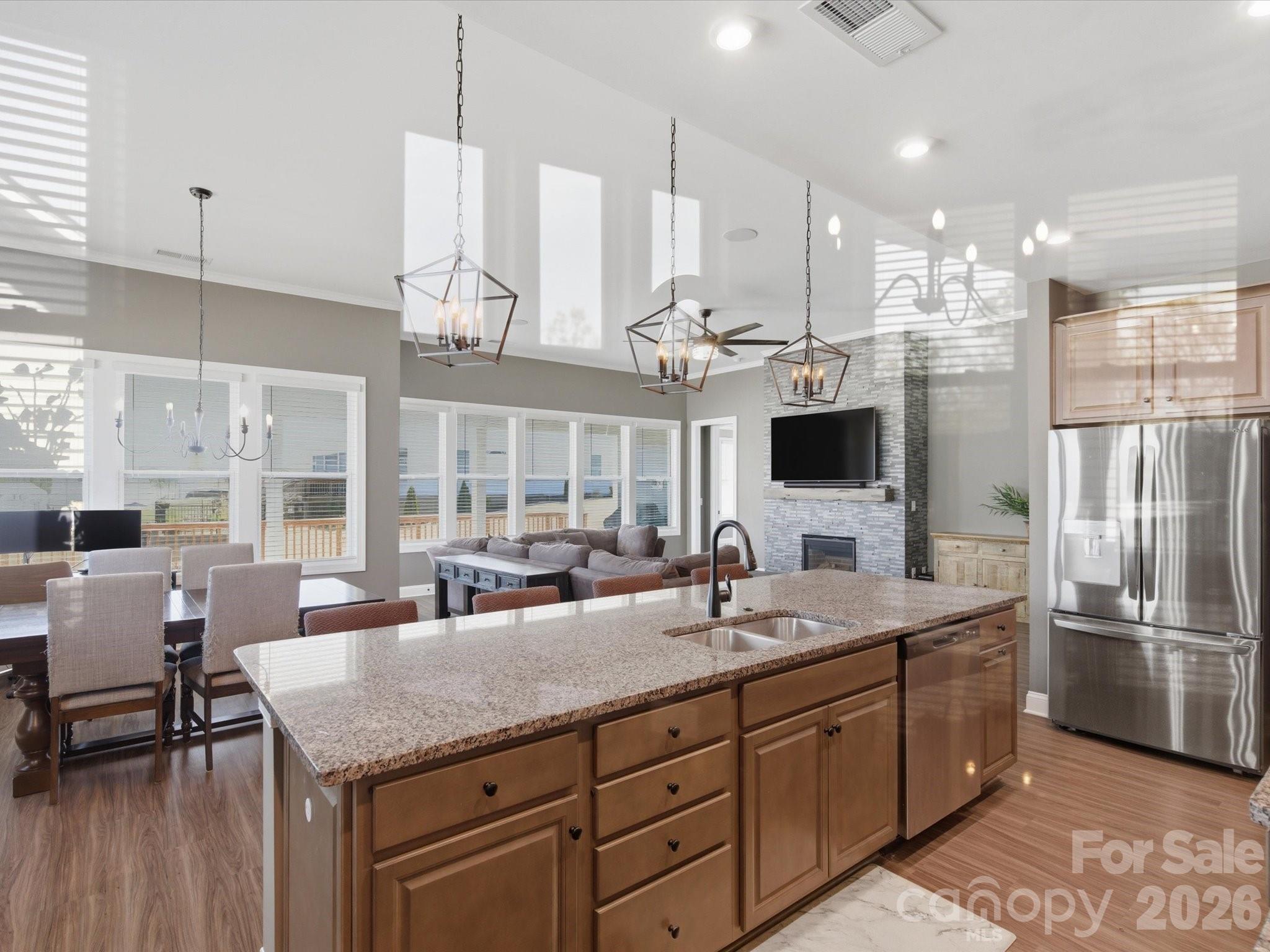 7004 Treetop Court York, SC 29745 - Photo 29 of 47 a kitchen with stainless steel appliances granite countertop a sink a stove and a refrigerator