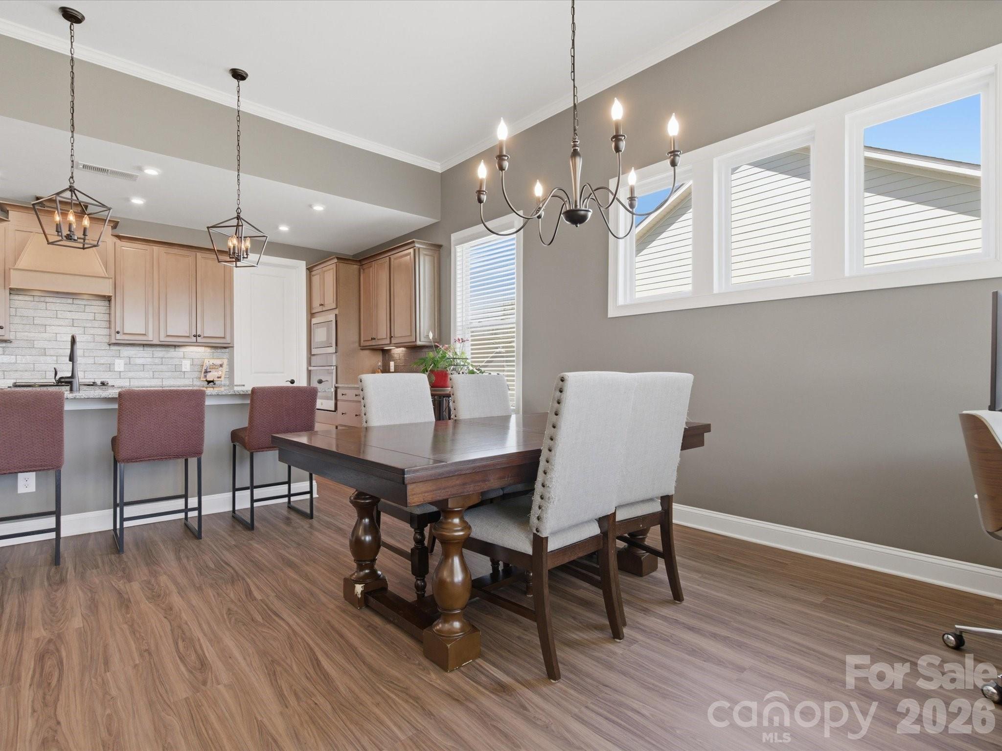 7004 Treetop Court York, SC 29745 - Photo 34 of 47 a view of a dining room with furniture and wooden floor