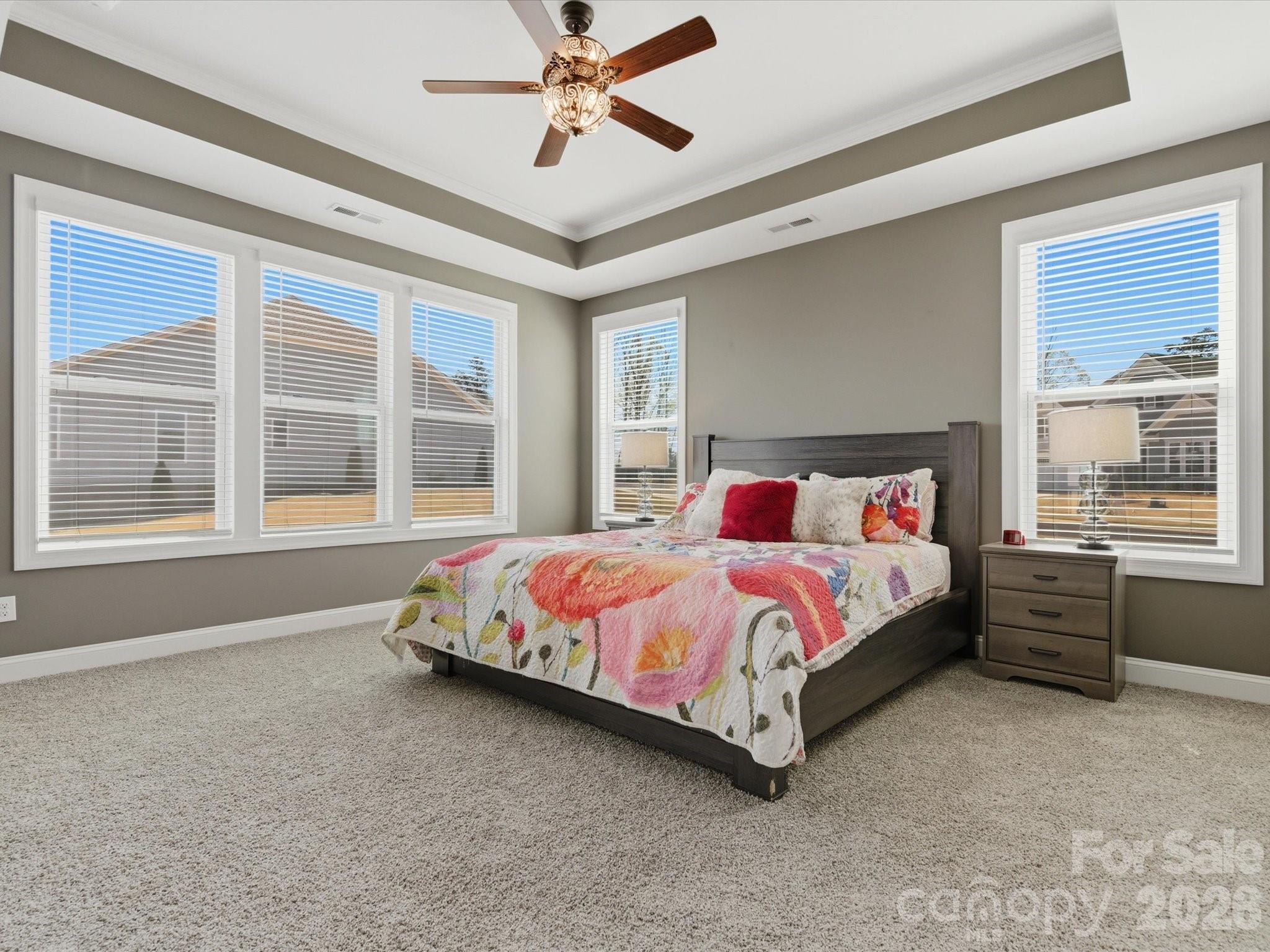 7004 Treetop Court York, SC 29745 - Photo 36 of 47 a bed sitting in a spacious bedroom next to a window