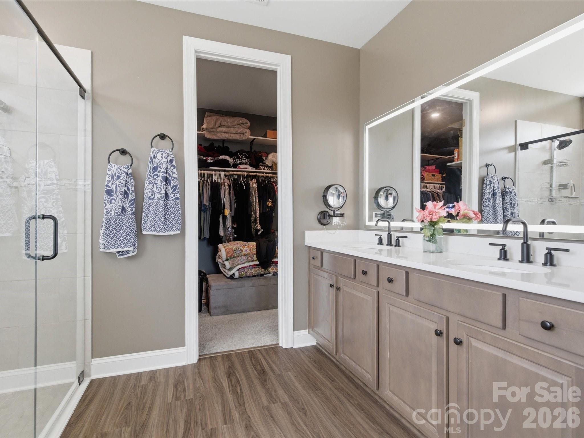 7004 Treetop Court York, SC 29745 - Photo 42 of 47 a spacious bathroom with a double vanity sink a mirror and shower