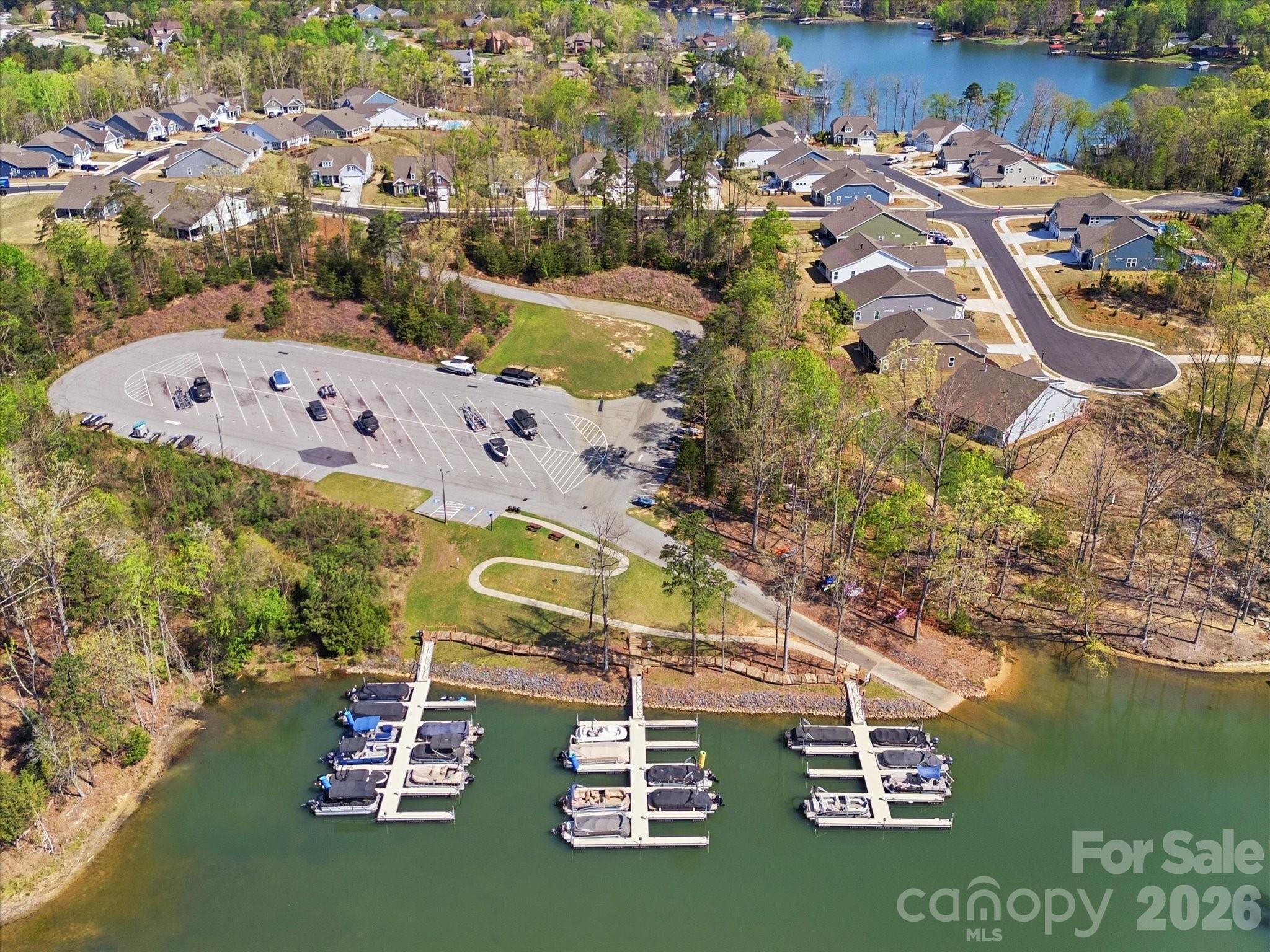 7004 Treetop Court York, SC 29745 - Photo 44 of 47 a view of a lake with a building in the background