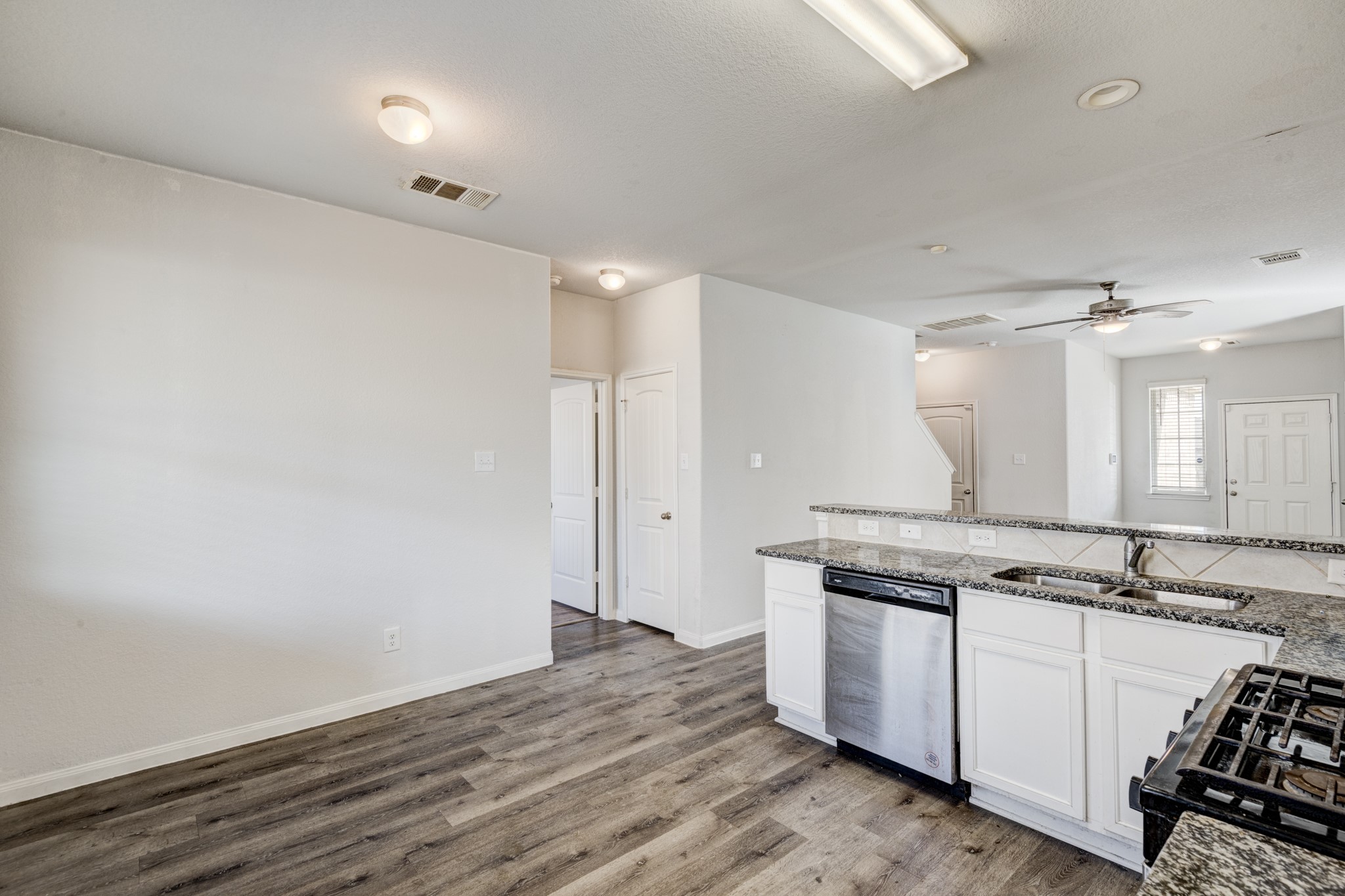 5011 Blue Jacaranda Way Spring Spring, TX 77373 - Photo 18 of 32 a view of a kitchen counter space a stove and wooden floor