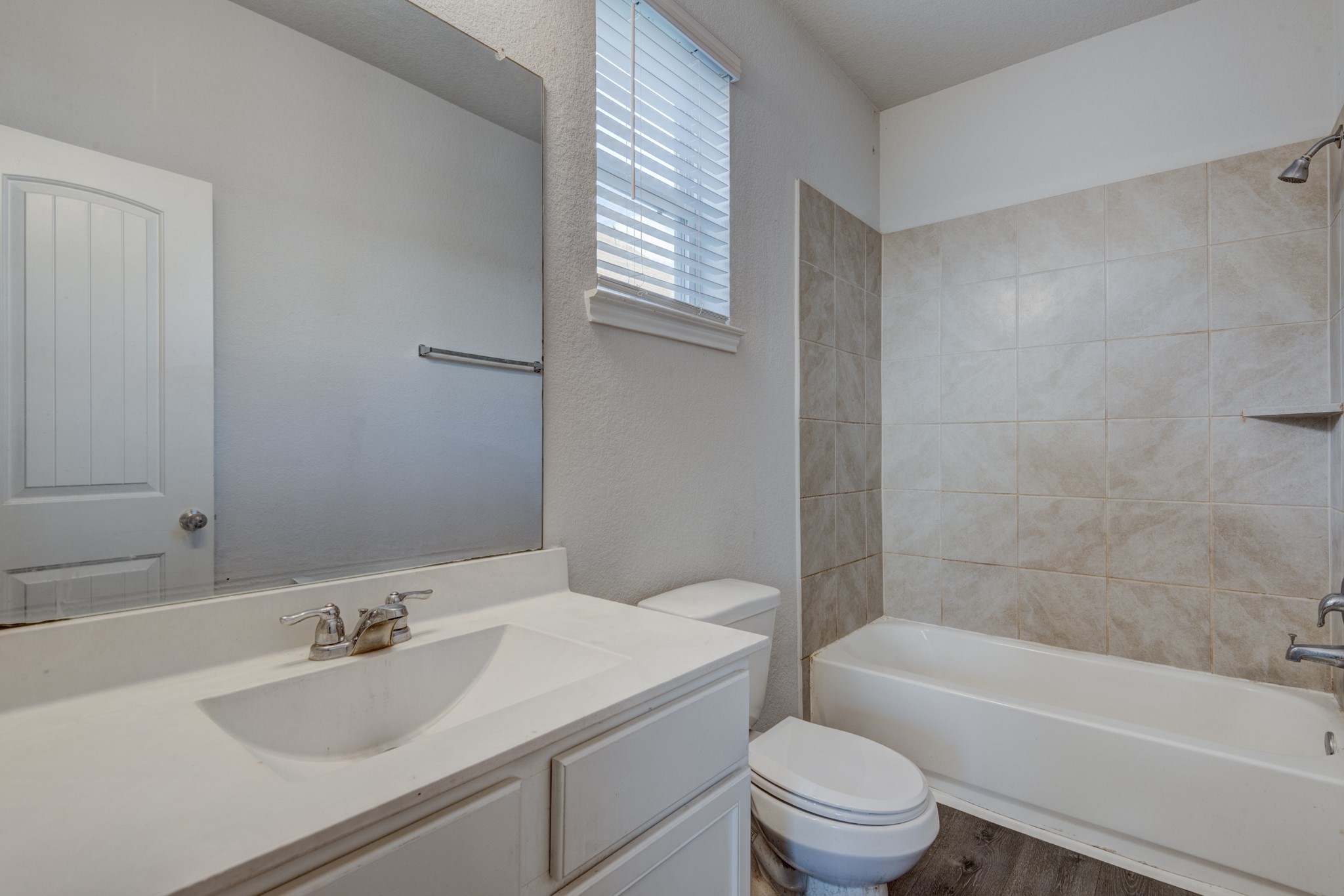5011 Blue Jacaranda Way Spring Spring, TX 77373 - Photo 20 of 32 a bathroom with a sink a toilet and shower