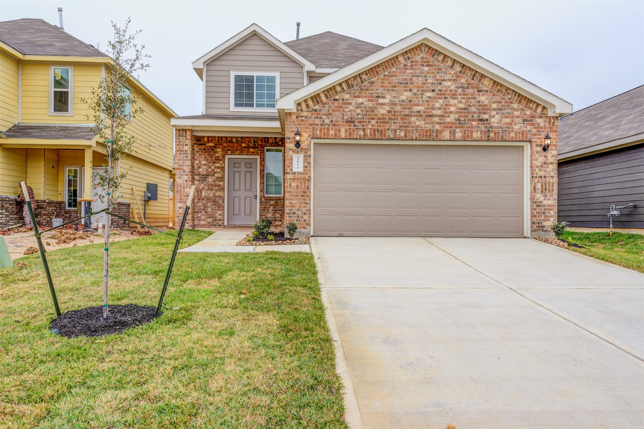 5011 Blue Jacaranda Way Spring Spring, TX 77373 - Photo 2 of 32 front view of a house with a yard