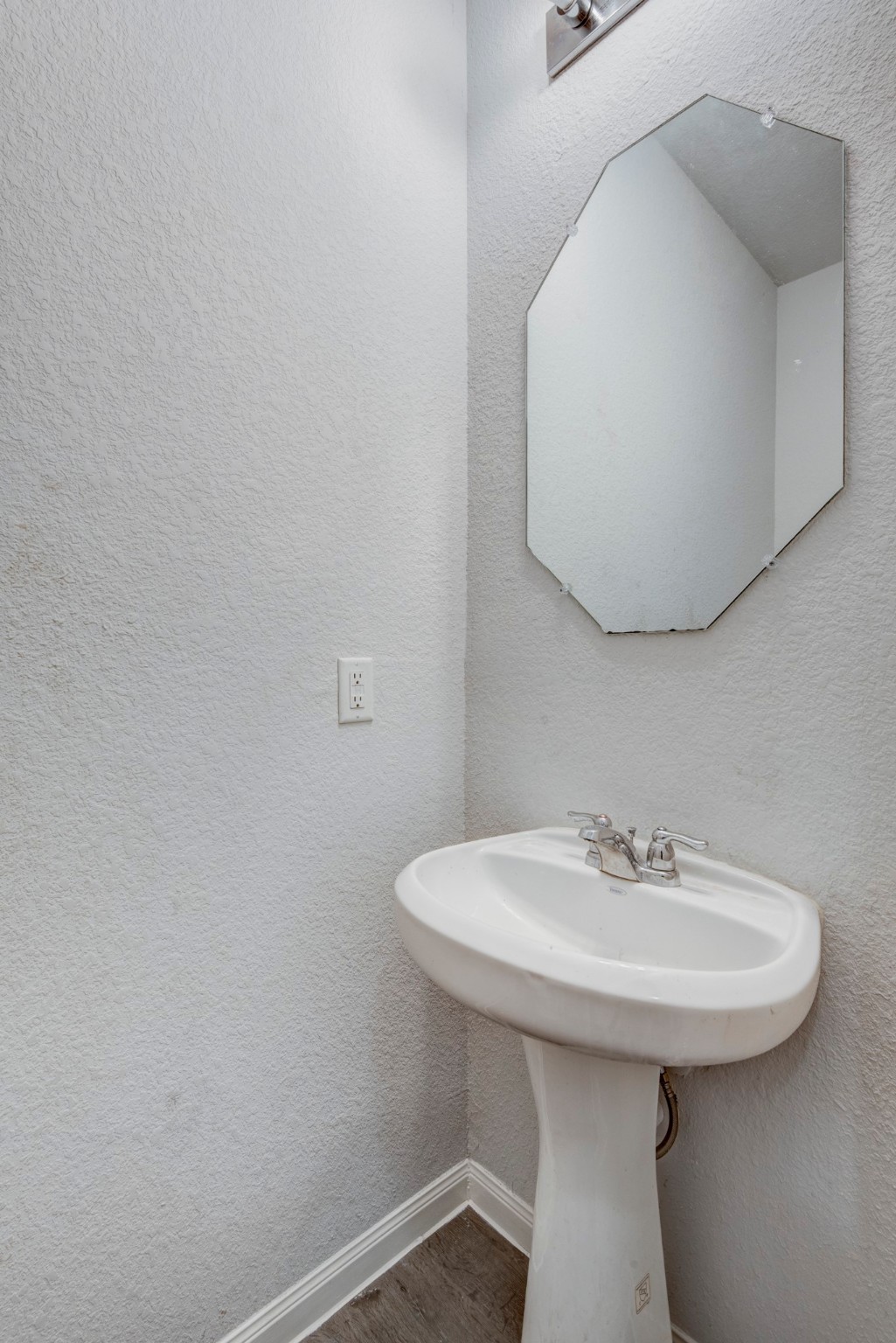 5011 Blue Jacaranda Way Spring Spring, TX 77373 - Photo 23 of 32 a bathroom with a sink a mirror and a toilet