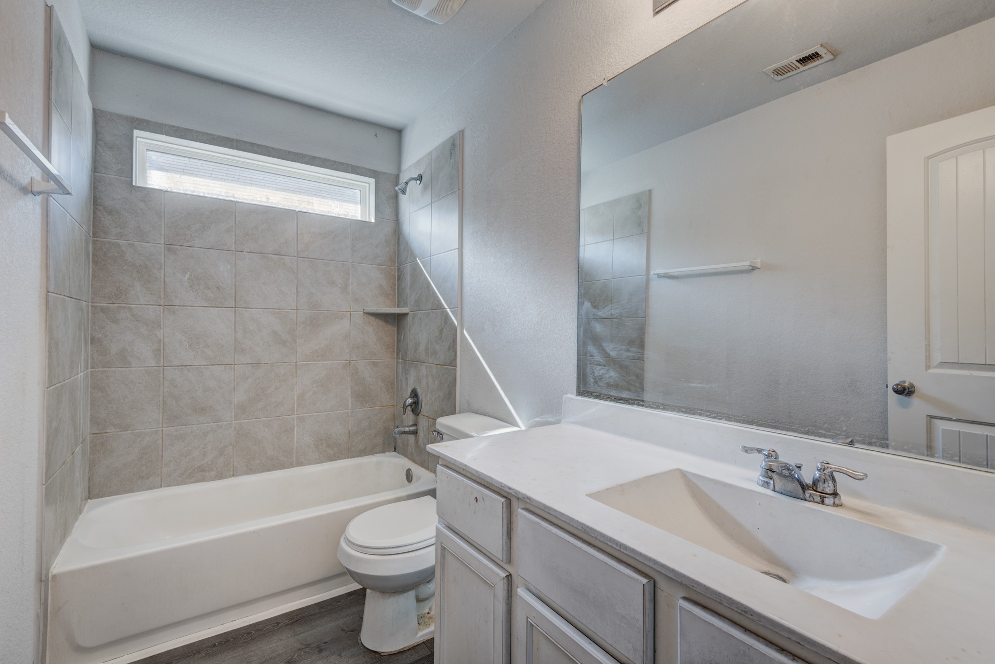 5011 Blue Jacaranda Way Spring Spring, TX 77373 - Photo 27 of 32 a bathroom with a sink a toilet and a bathtub