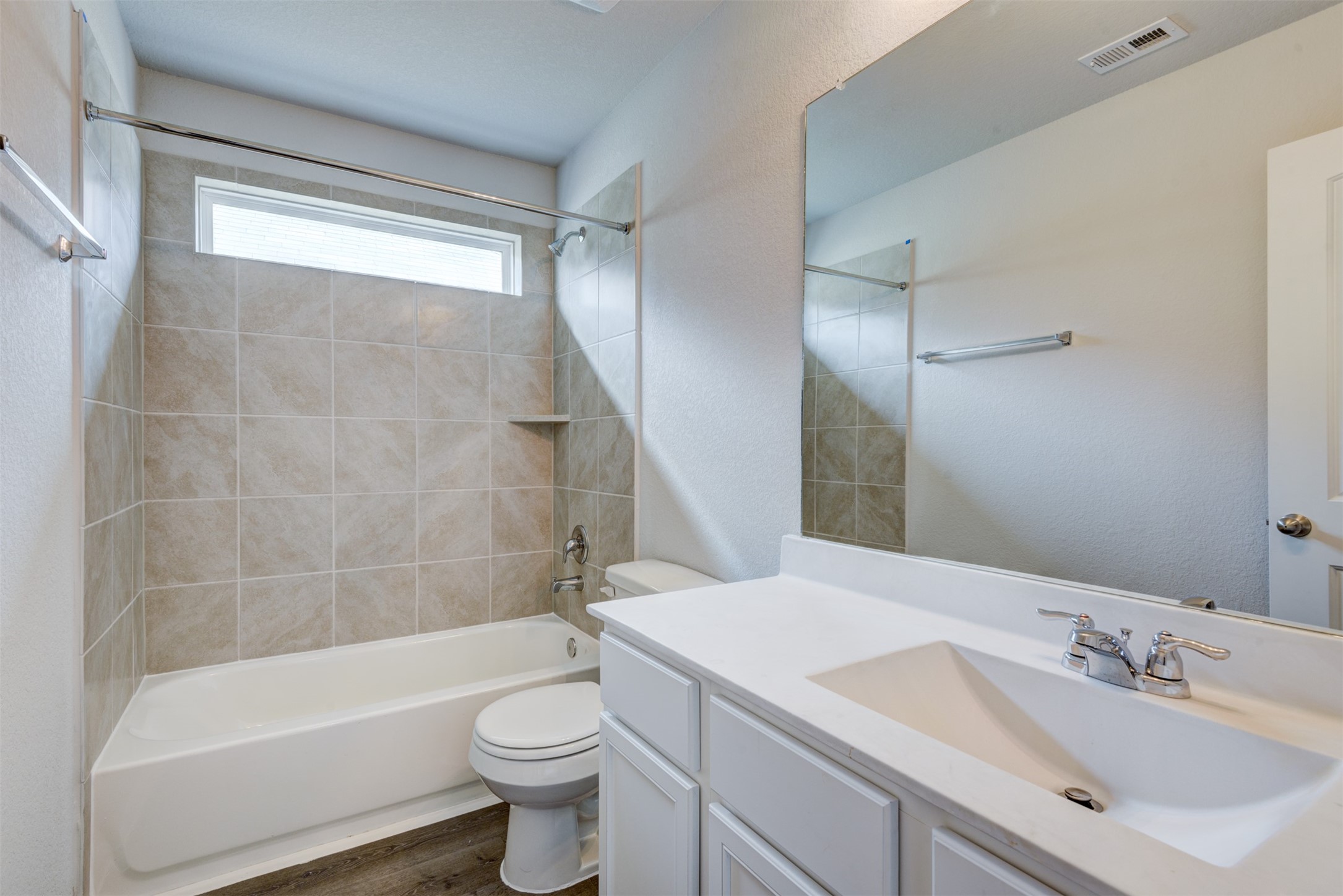 5011 Blue Jacaranda Way Spring Spring, TX 77373 - Photo 30 of 32 a bathroom with a sink a toilet and a bathtub