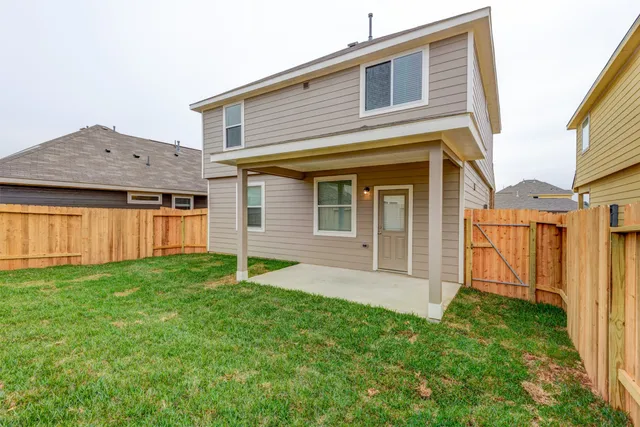 a view of front of house with a yard