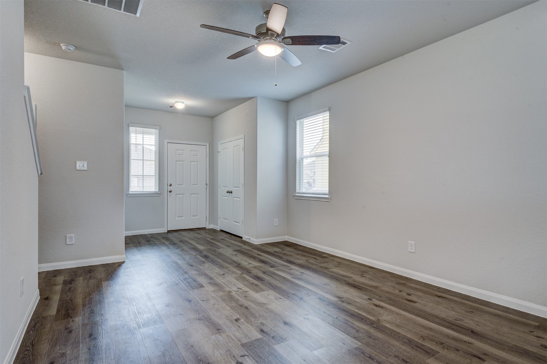 5011 Blue Jacaranda Way Spring Spring, TX 77373 - Photo 10 of 32 wooden floor in an empty room with a window