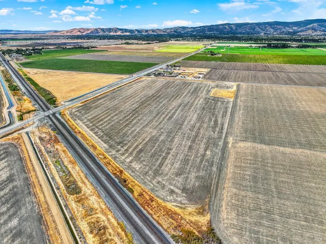 a view of swimming pool with a garden and seating area