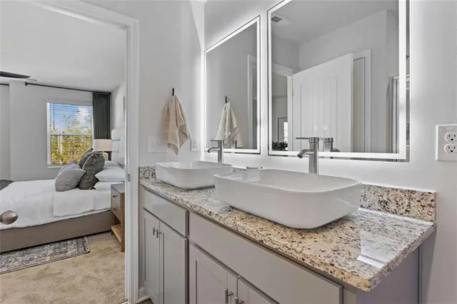 a bathroom with sinks granite countertop a sink and a mirror