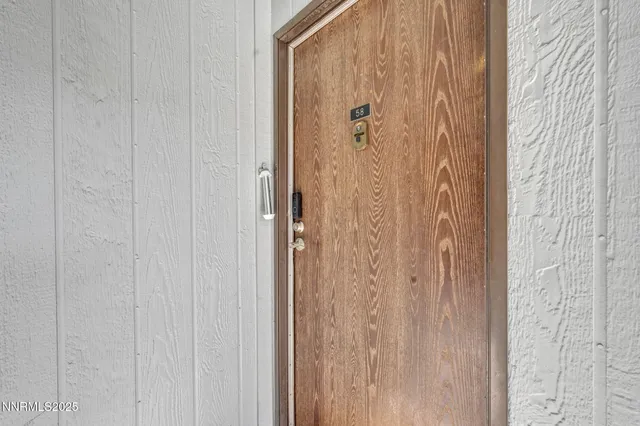 a bathroom with a shower and a door