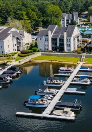 a view of a house with pool and a yard
