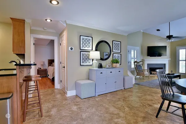 a kitchen with stainless steel appliances granite countertop a sink a stove and a refrigerator