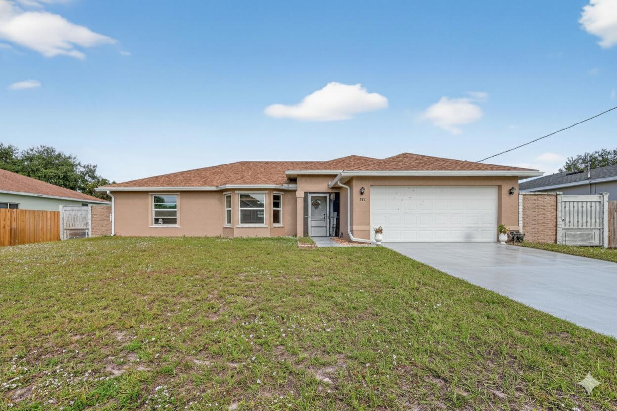 557 Southwest Halkell Avenue Port St. Lucie, FL 34953 - Photo 1 of 36 Front of house 1