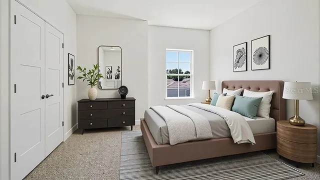 a bedroom with a bed and a dresser