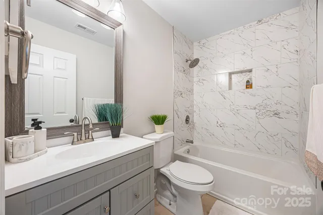 a bathroom with a sink a toilet and a bathtub