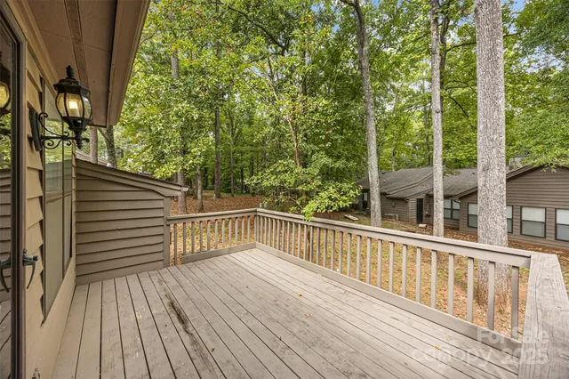 a view of a balcony with wooden floor