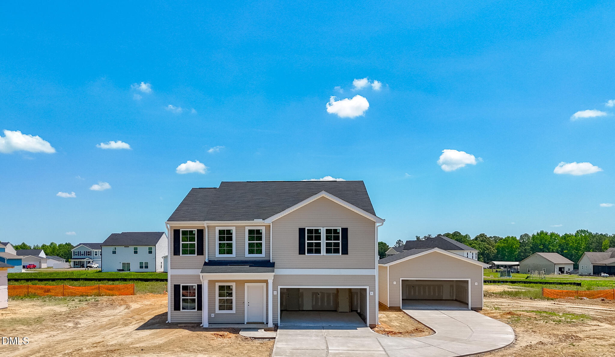 71 Lowell Cove Angier, NC 27501 - Photo 1 of 10 a front view of a house with a yard and a garage