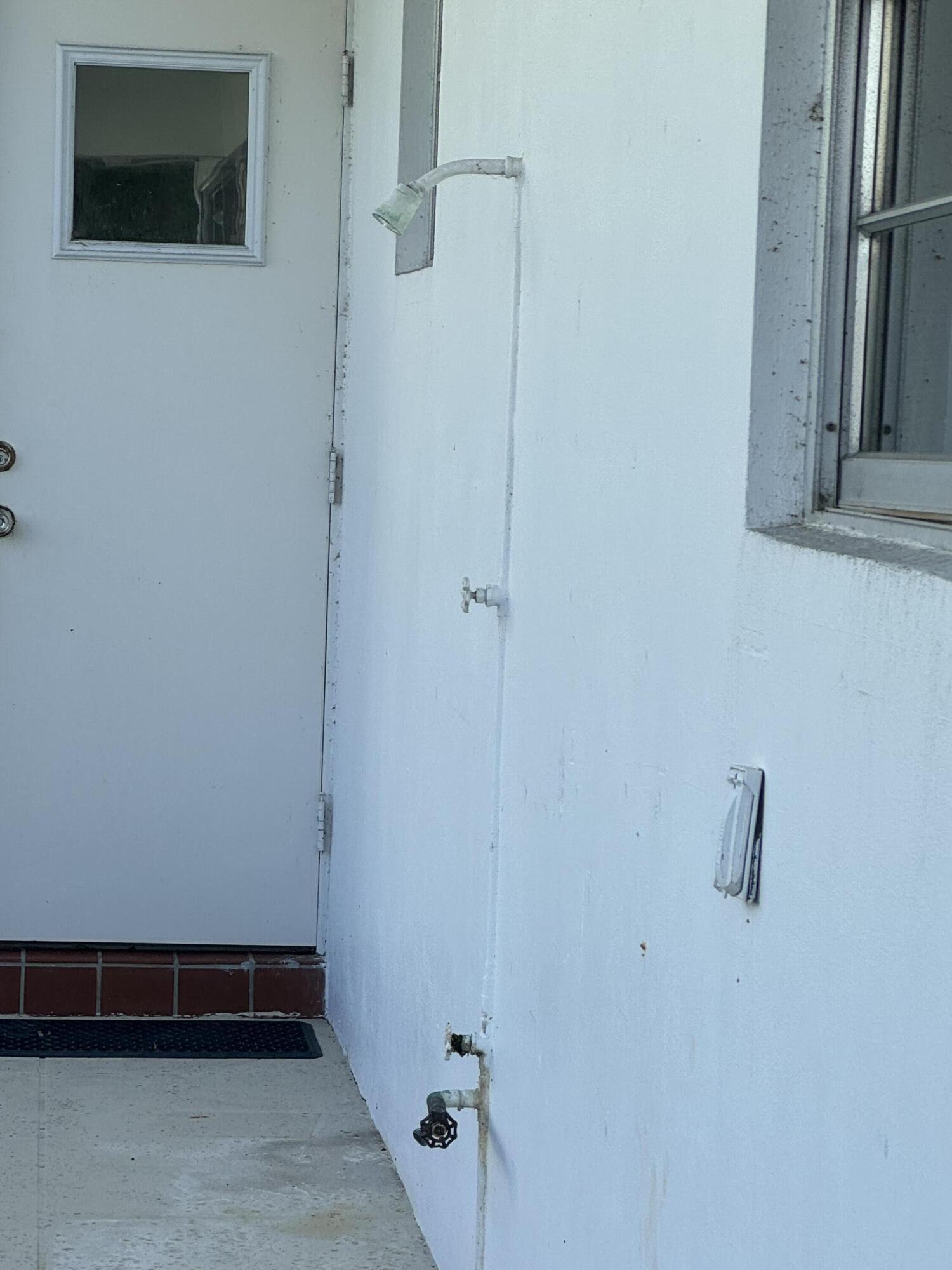 954 Marlin Circle Jupiter, FL 33458 - Photo 16 of 22 a view of a room with racks on the wall