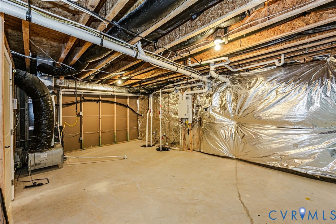 7435 Wicks Road Williamsburg, VA 23188 - Photo 72 of 82 Unfinished basement featuring exposed wood joists,