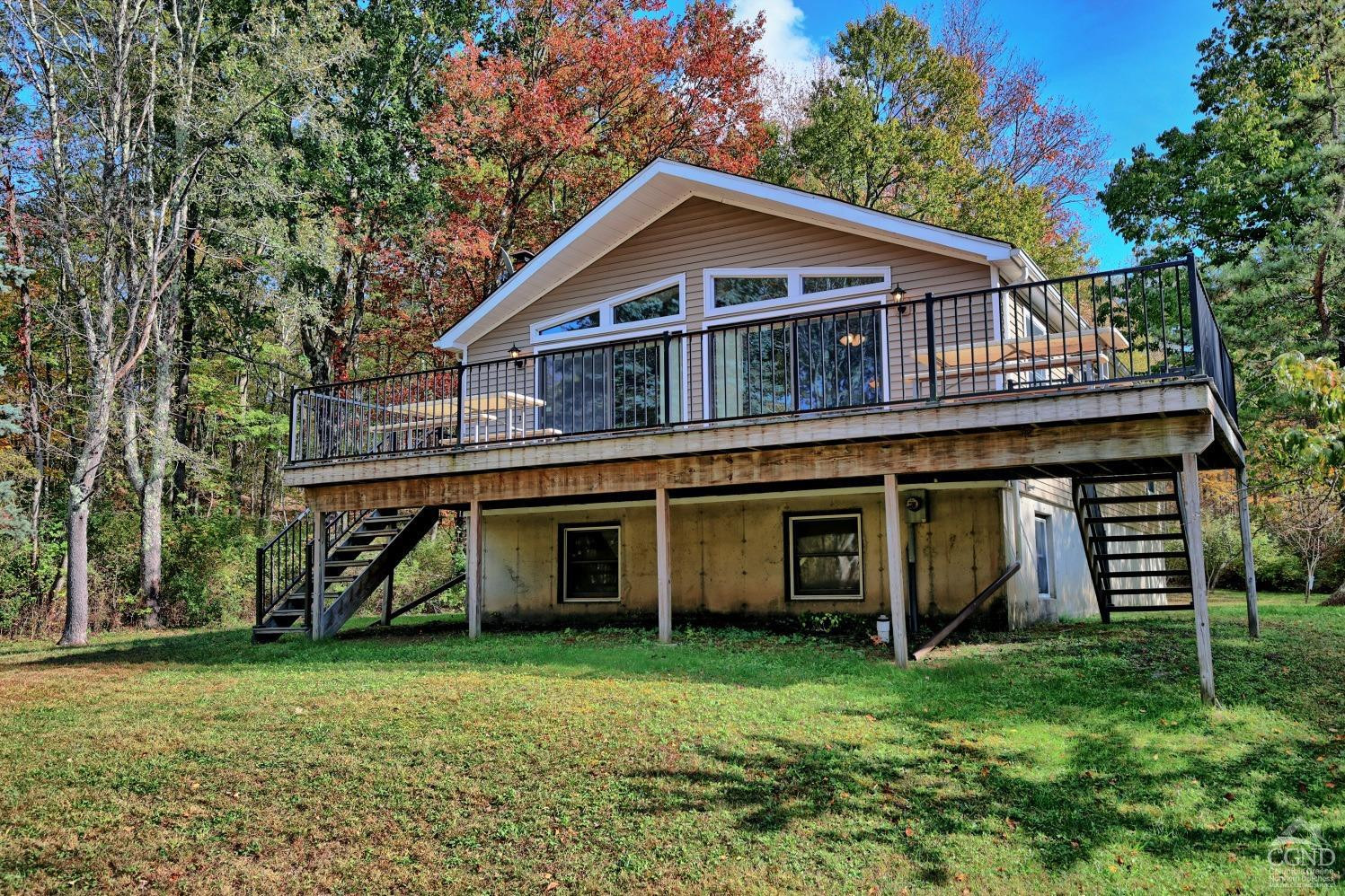 496 New Forge Road Ancram, NY 12502 - Photo 1 of 87 a front view of a house with garden