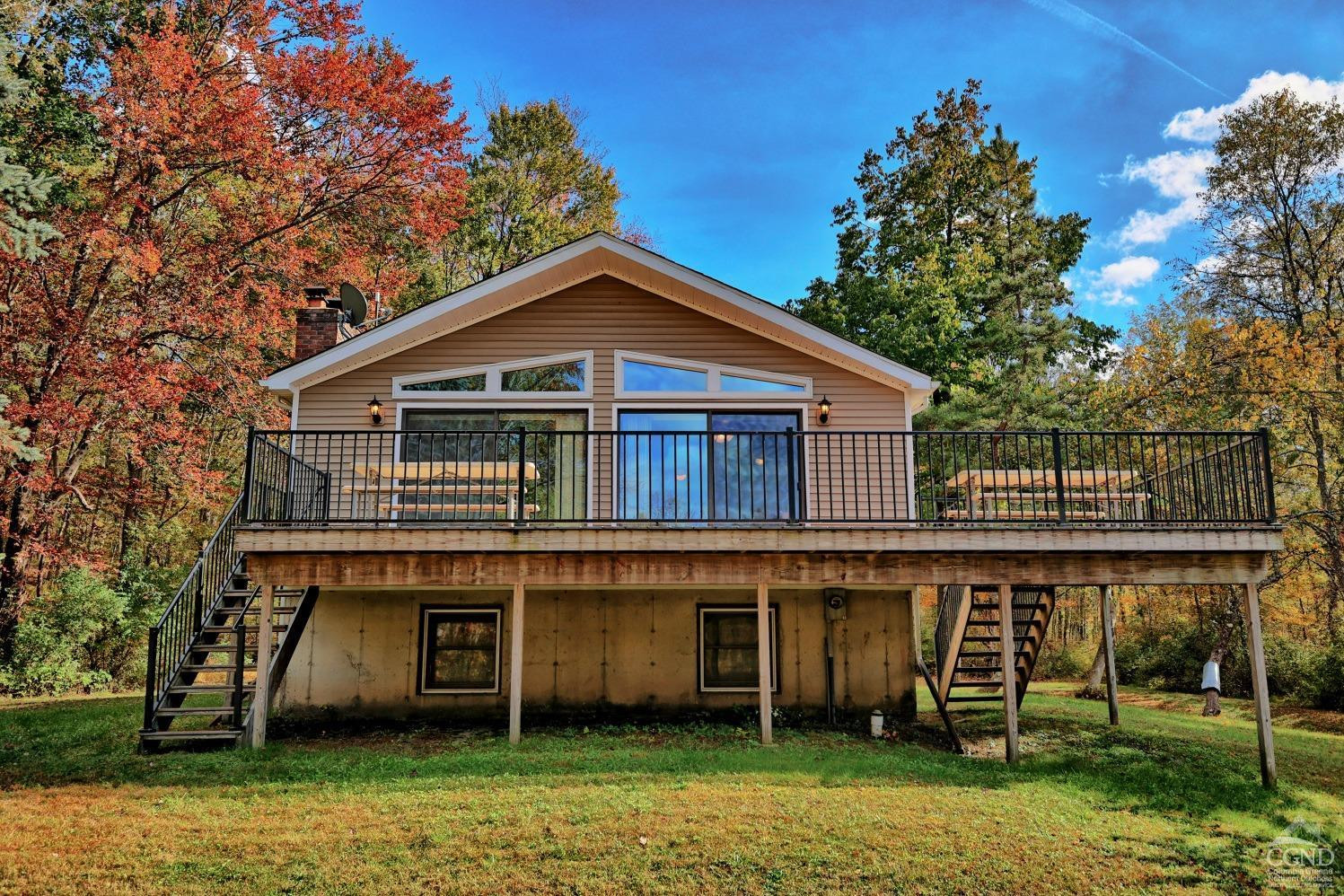 496 New Forge Road Ancram, NY 12502 - Photo 2 of 87 a front view of a house with a garden